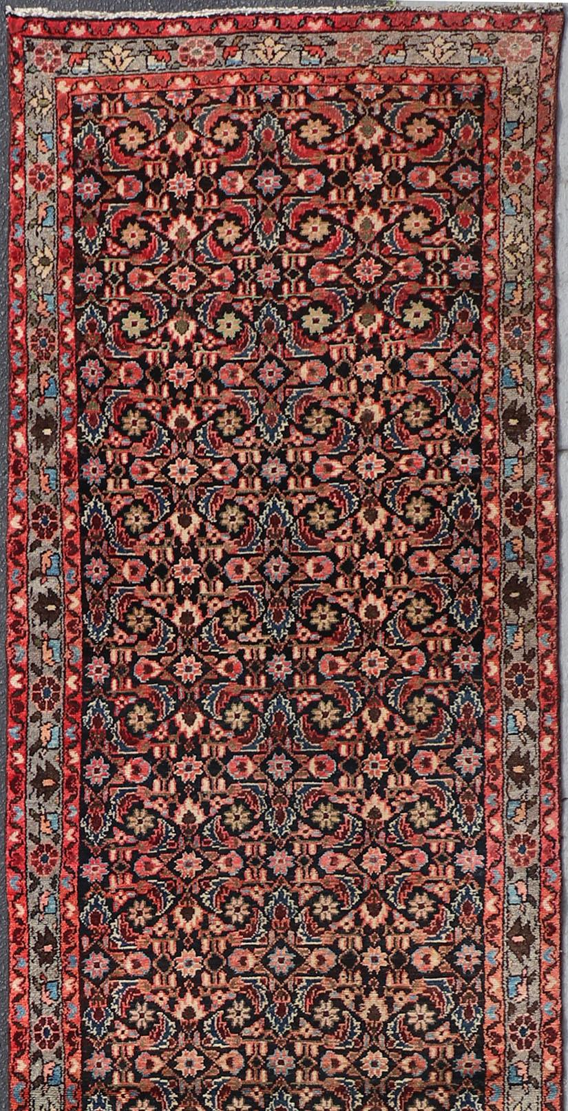 Sub-geometric Floral design Malayer runner vintage Persian in red and black, rug H-501-4, country of origin / type: Iran / Malayer, circa 1950.

This magnificent vintage Persian Malayer runner (circa 1950) bears a beautiful, expansive, all-over