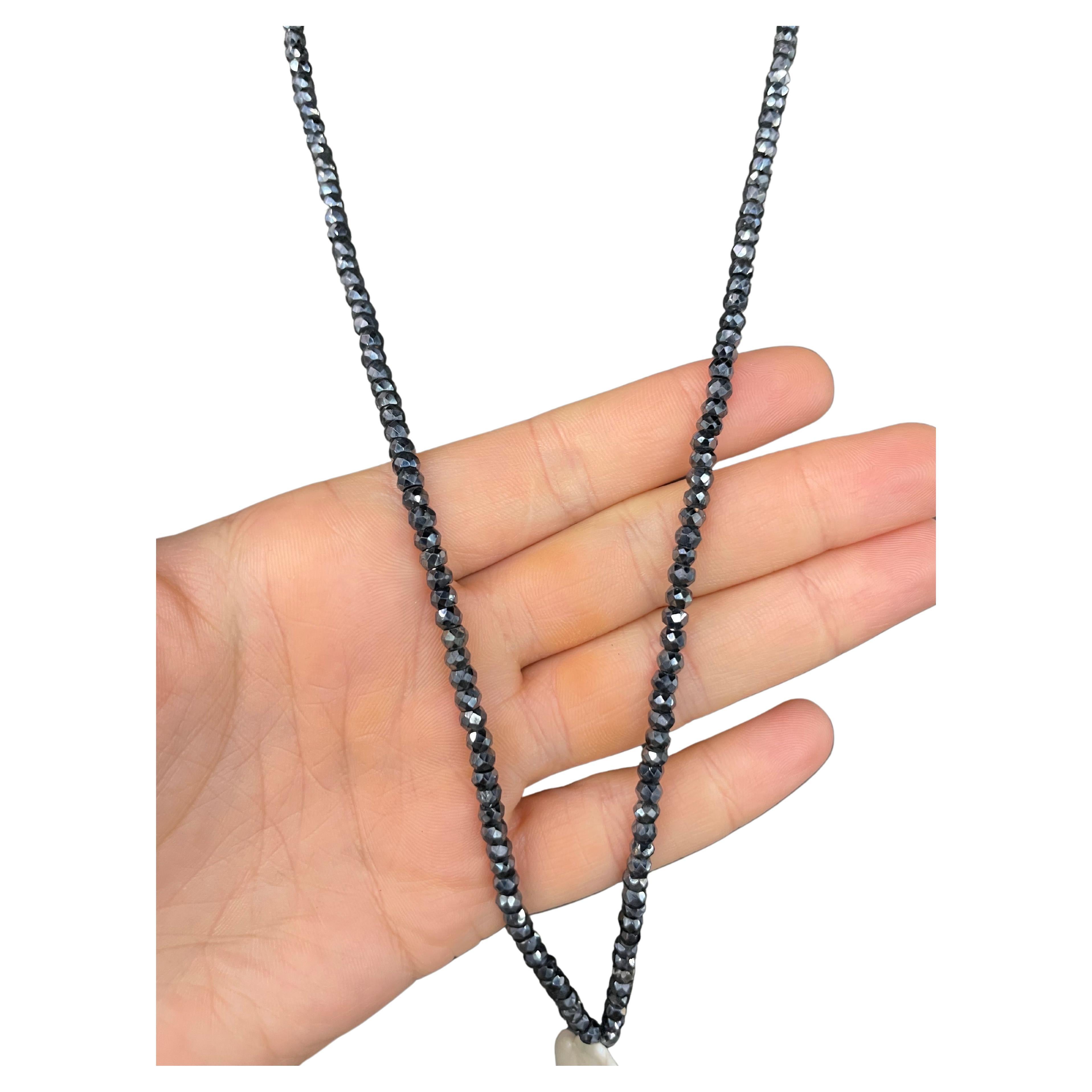 Long Mystic Spinel beads measuring 30.5 inches with a drop featuring three Baroque Pearls. 
Necklace 30.5 Inches 
Drop 5.5 Inches