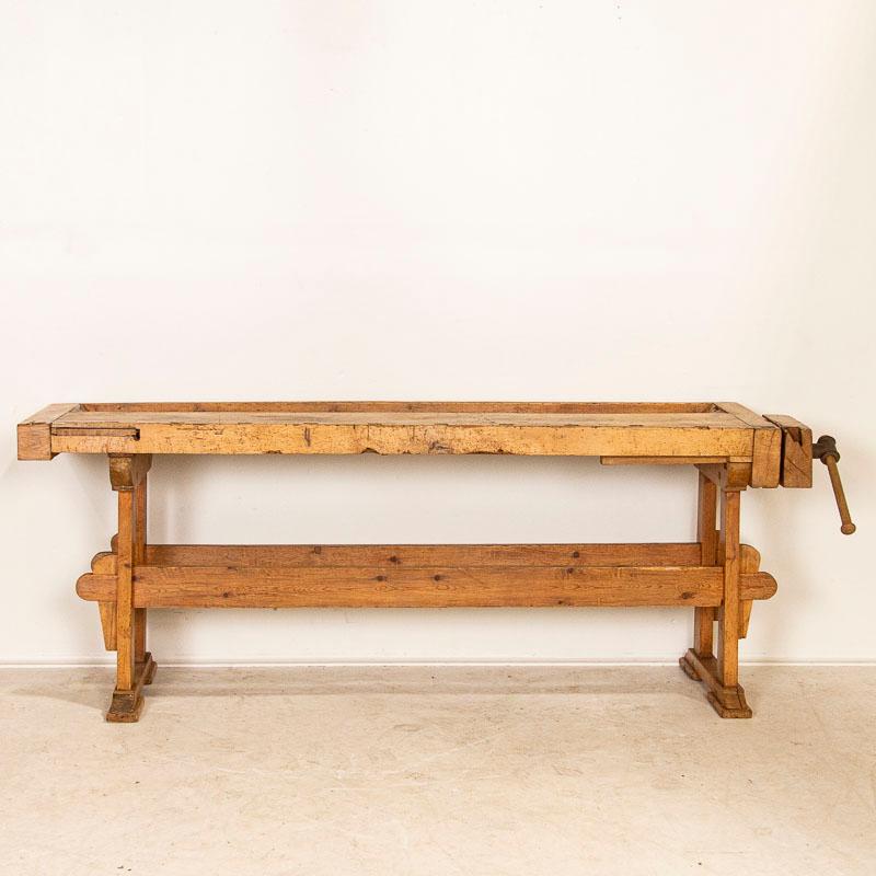 This rustic carpenters’ workbench reveals a rich patina after years of traditional use. Please examine the close up photos to appreciate the depth of the patina and notice the dings, scrapes and stains that reflects how much it was used. It is