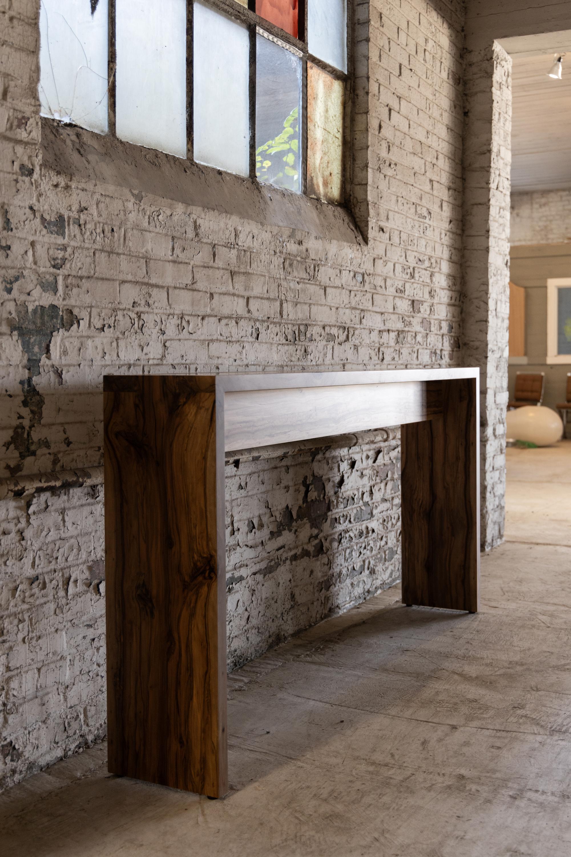 Rustic yet refined with air-tight box joints, our Spider Console Table is handcrafted by Alabama Sawyer from Alabama urban sweet gum trees. Often referred to as satin walnut, sweet gum wood is a durable, closed grain wood that has a strong contrast