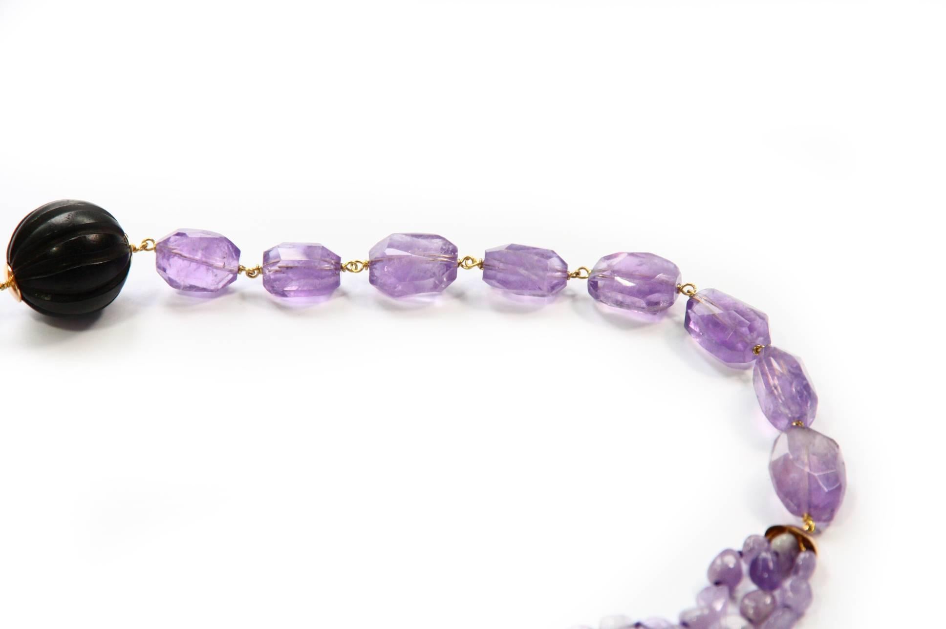 Long necklace different kind of Amethyst carved Ebony pearls Carved Jade 18kt Gold gr.10,20.
This series named half half you can wear in different way moving it on your neck.
All Giulia Colussi jewelry is new and has never been previously owned or