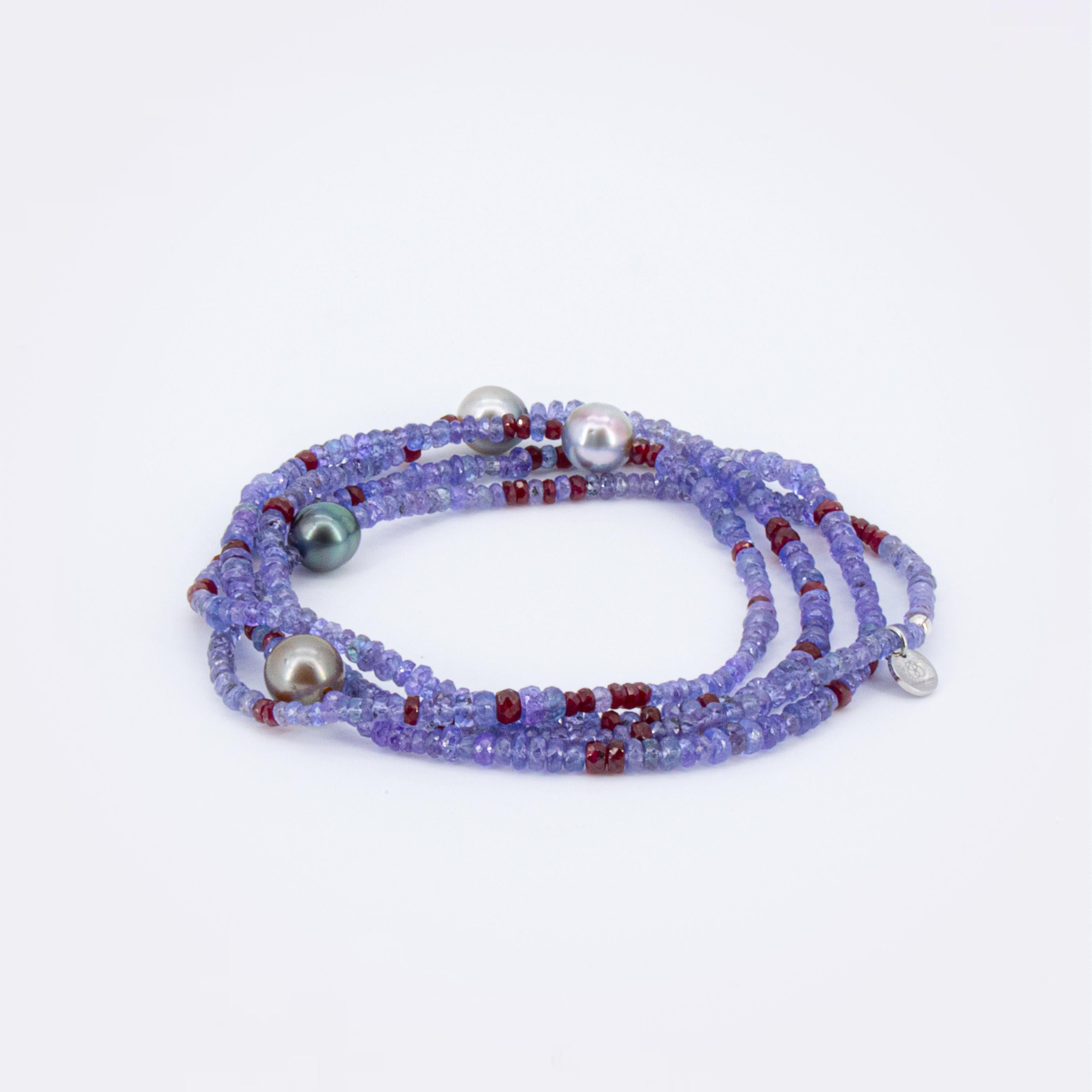 This necklace is a highlight just in the context of its meaning and the mutual support of the natural ruby with the tanzanite. The beads fit beautifully in color with this purple/red ensemble and make the stones sparkle even more. 
It has a great