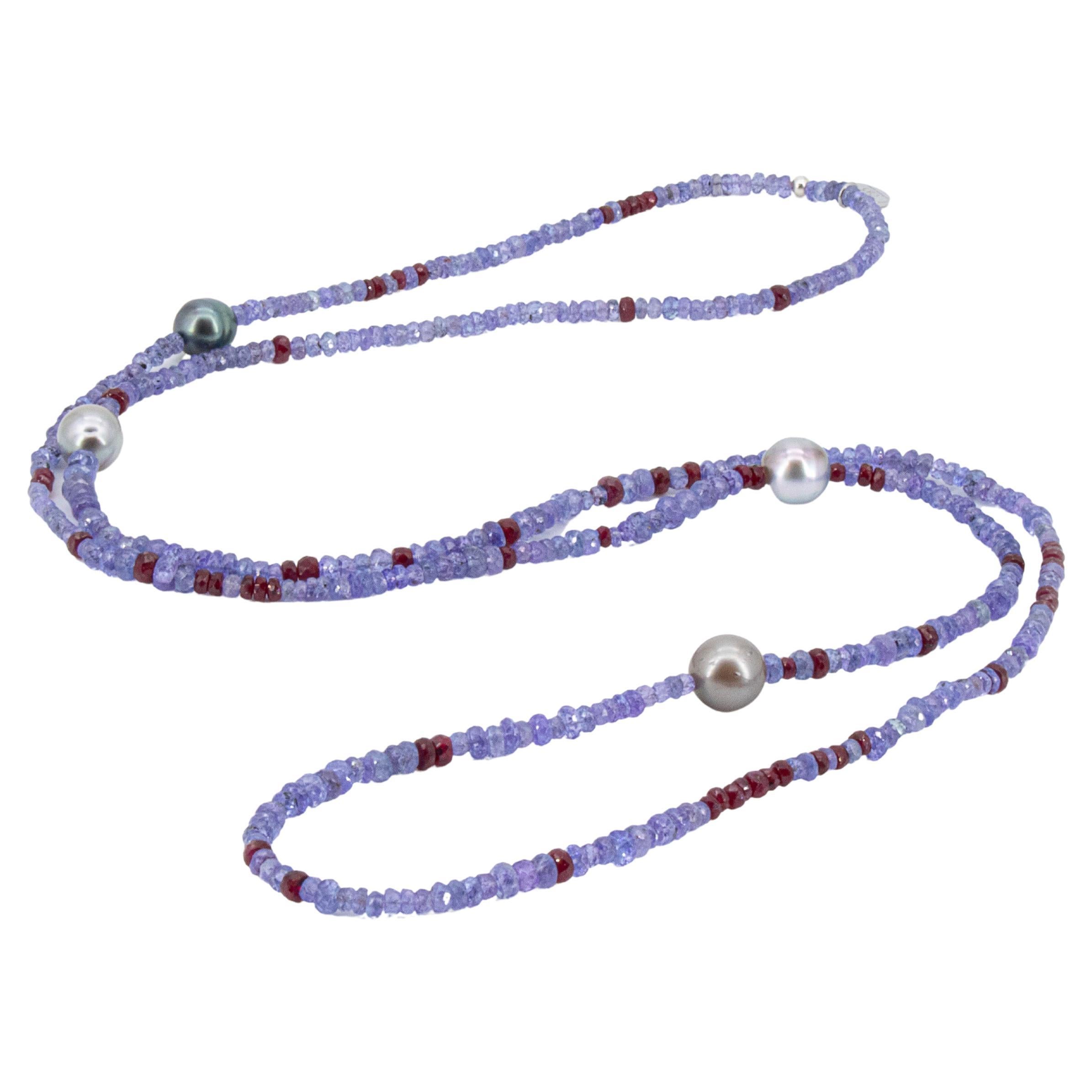 Long necklace with about 110 carats natural tanzanites, rubies and Tahiti pearls