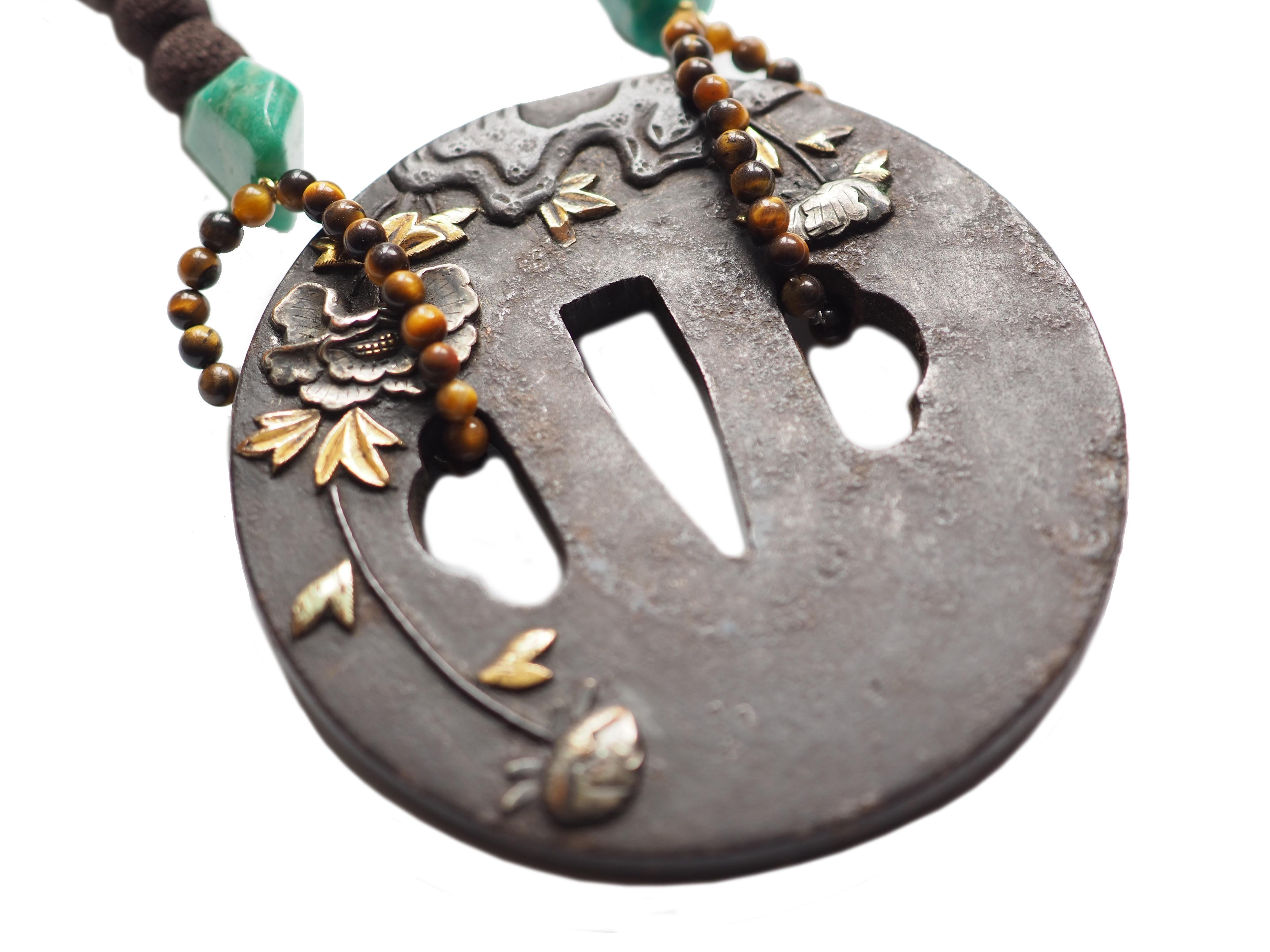 Long Necklace with Madrepora Coral Amazzonite  tiger eye's Antiques  Japanies Tsuba. Length 80cm
Tsuba are the antiques Samurai hand garden of Japanies sward. The  Tsuba balanced the sword and protect the hand of sword holder  but at the same time
