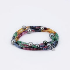 Long Necklace with Tahiti pearls and about 150 carat gemstones