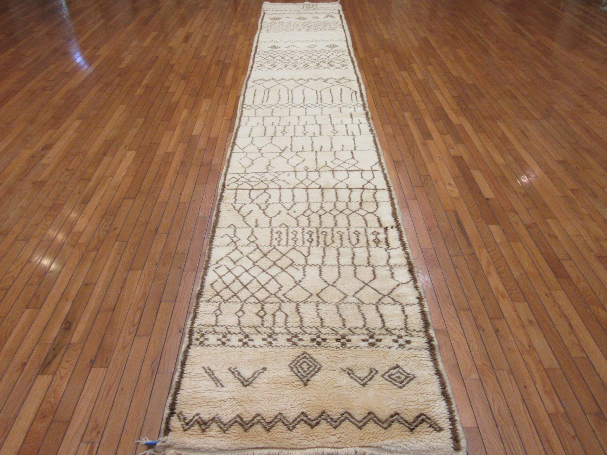 This is a new long hand knotted genuine Moroccan runner rug. It is made with wool in a very simple design.
The rug measures 3' x 17' and in new condition.