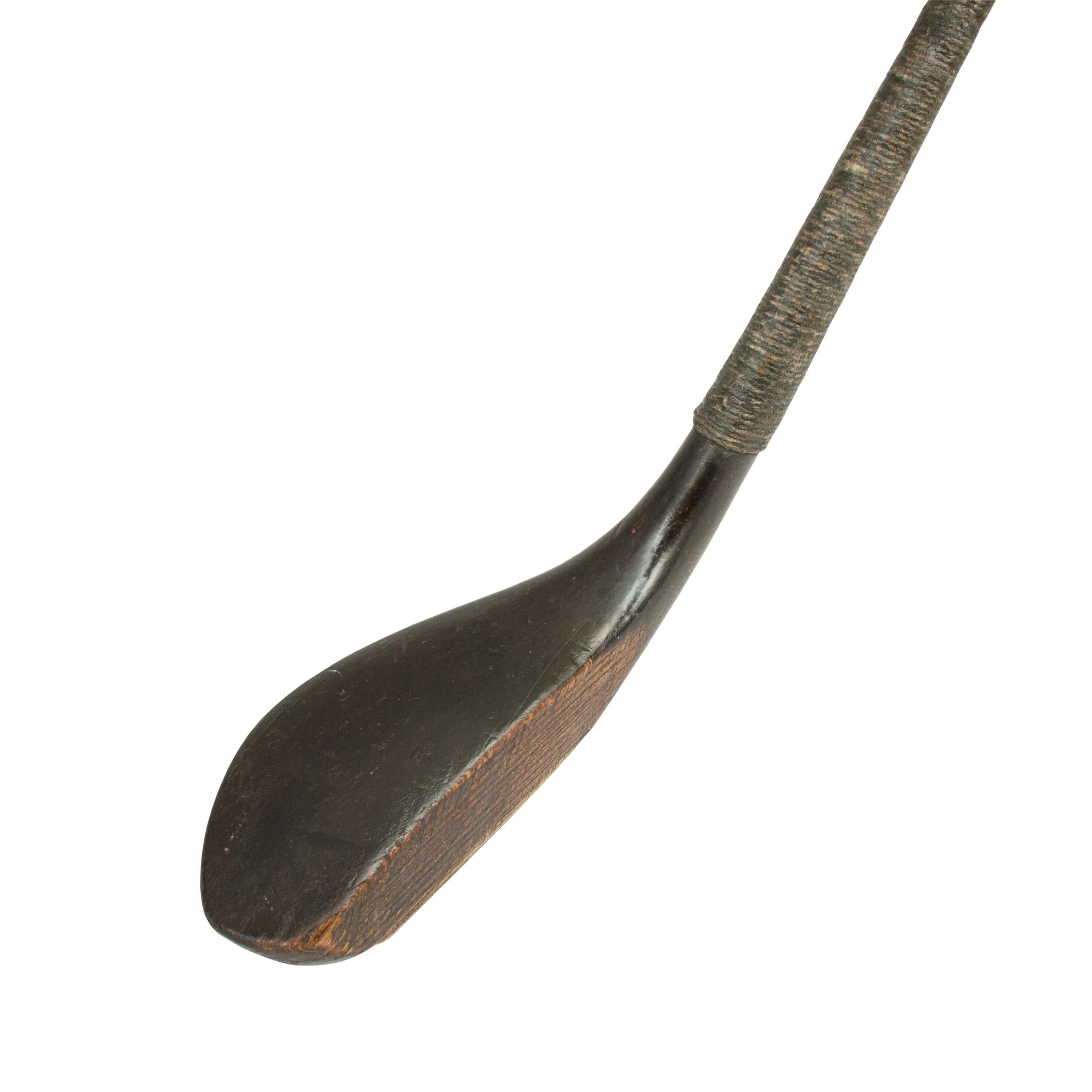 Long Nose Golf Club by Mitchell.
A superb long nosed golf club, the polished blackened beech wood head with faint name stamp, most probably 'MITCHELL'. This refers to David Mitchell, a club maker from St. Andrews and Carnoustie, and not the