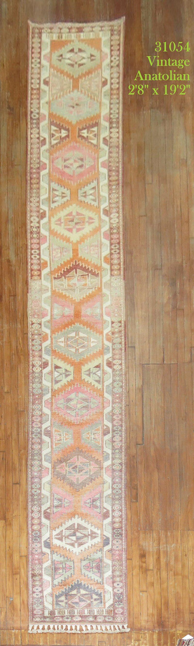 A rare long and narrow 20th century Turkish geometric runner with a dominant orange color. You need an extremely long and narrow hallway for this beauty

Measures: 2'8