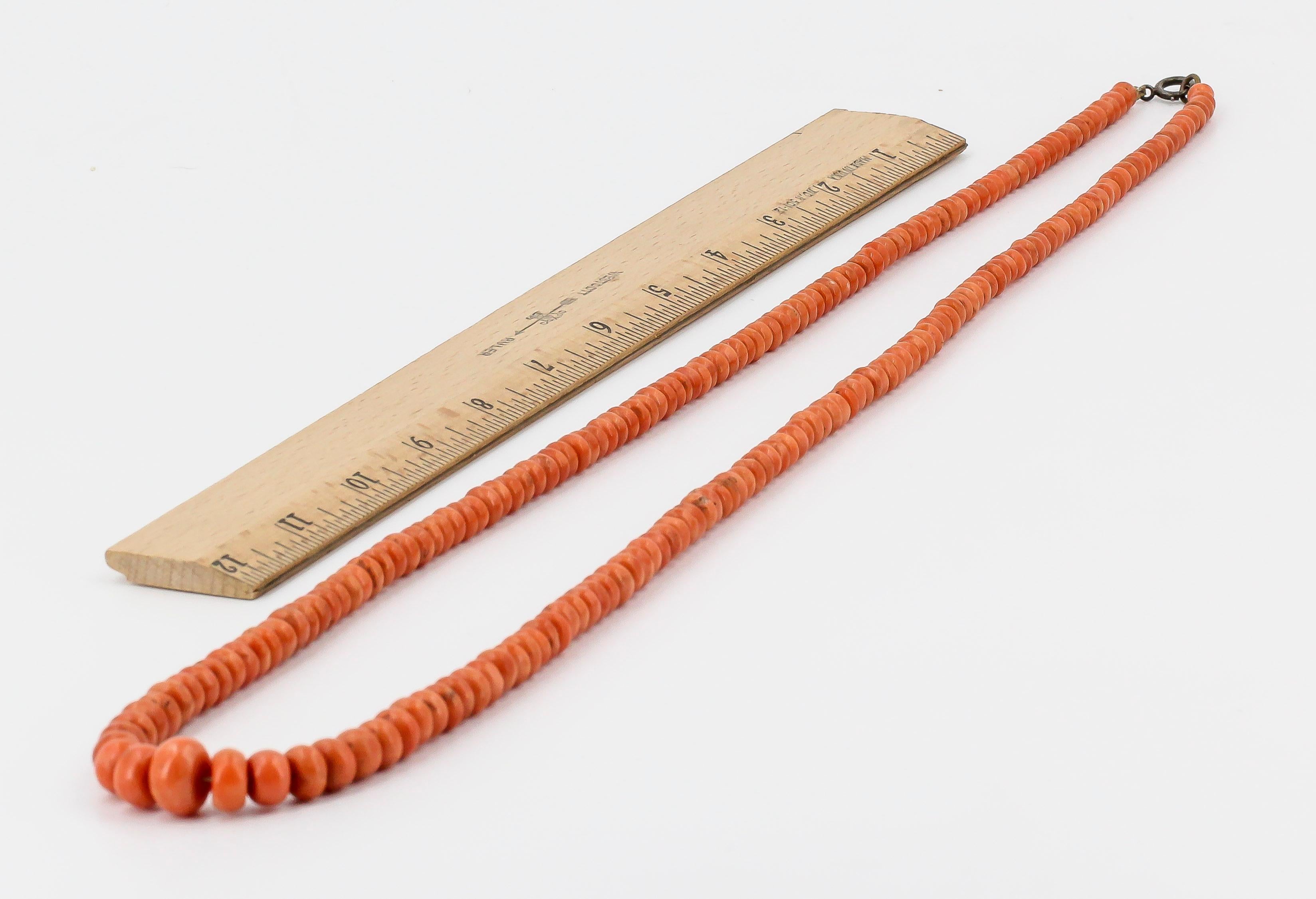 Stylish coral necklace of Oriental origin, circa 1930s-40s. It features beads ranging from 4mm to 12mm in diameter and its total length is 38