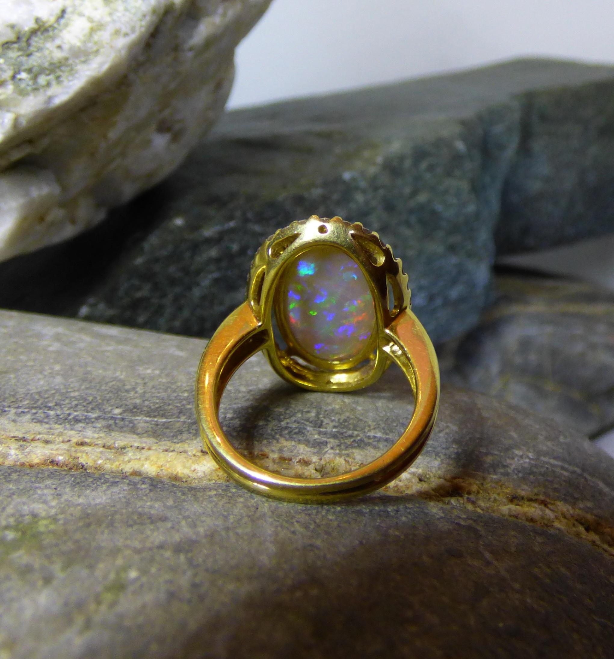 Contemporary Long Oval Opal '5.79ct' and Diamond Cluster Ring in 18k Gold For Sale