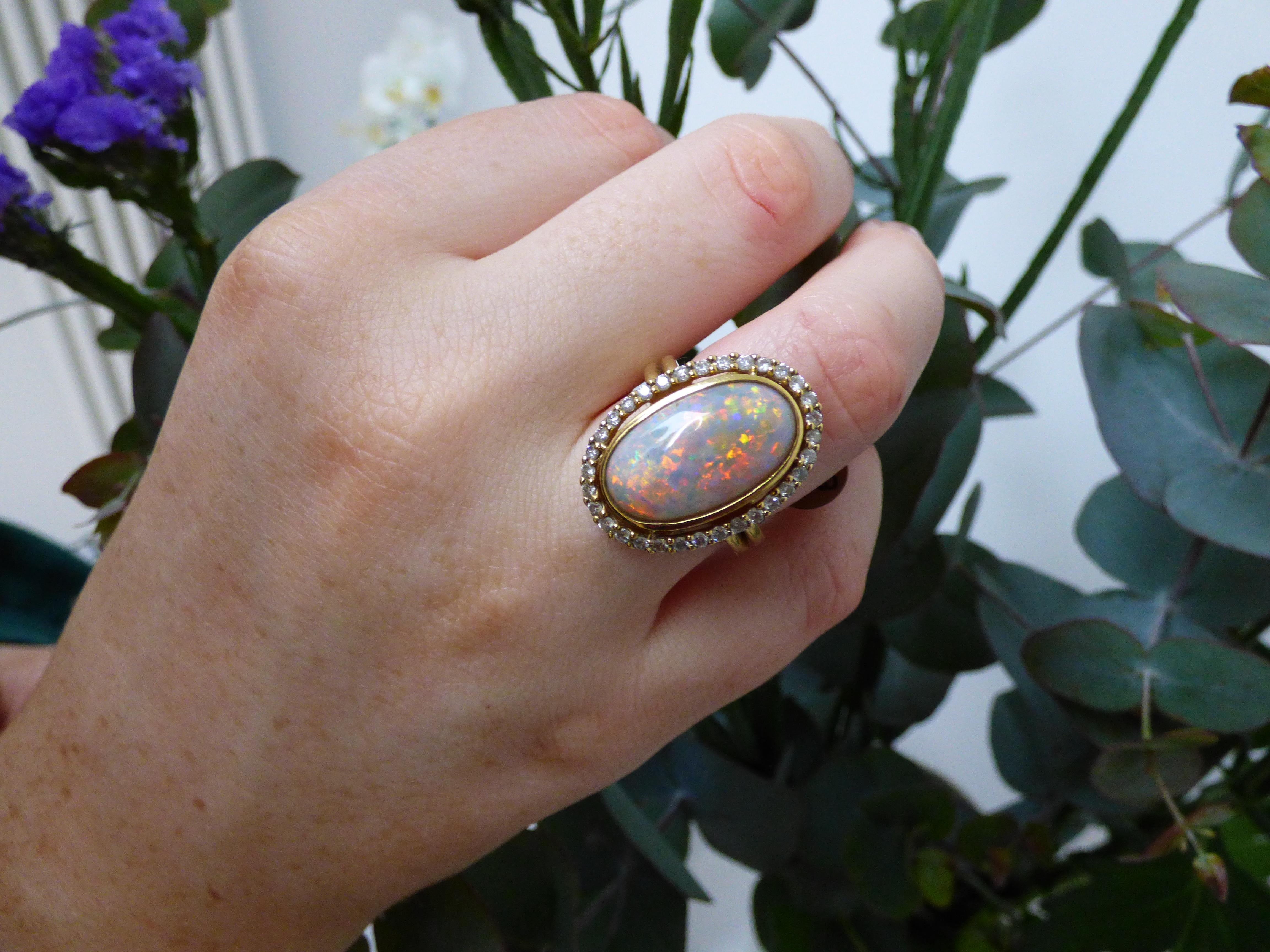 Brilliant Cut Long Oval Opal '5.79ct' and Diamond Cluster Ring in 18k Gold For Sale