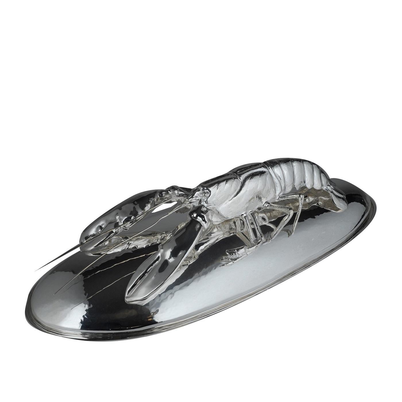 The magnificent decoration gracing the lid of this oval tray will make a statement in any decor and will give a dining room a luxurious feel and sophisticated touch. The entire piece is crafted in silver plated metal and the lobster is executed in