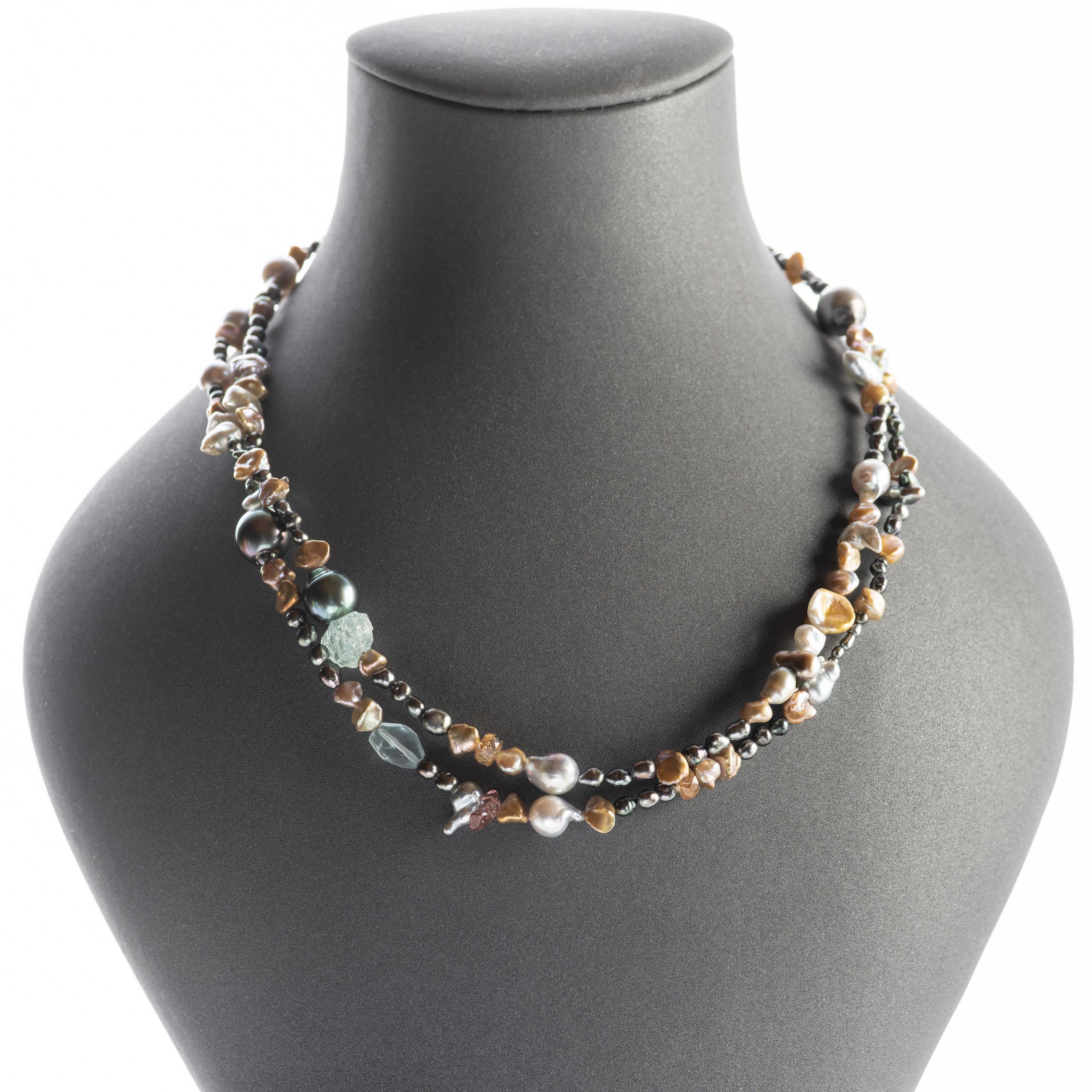 Naturally-colored South Sea Keshi, baroque Tahitian, luminous Akoya, and Chinese freshwater pearls are strung together with glassy aquamarine and tourmaline crystals to create a luxuriously long -36