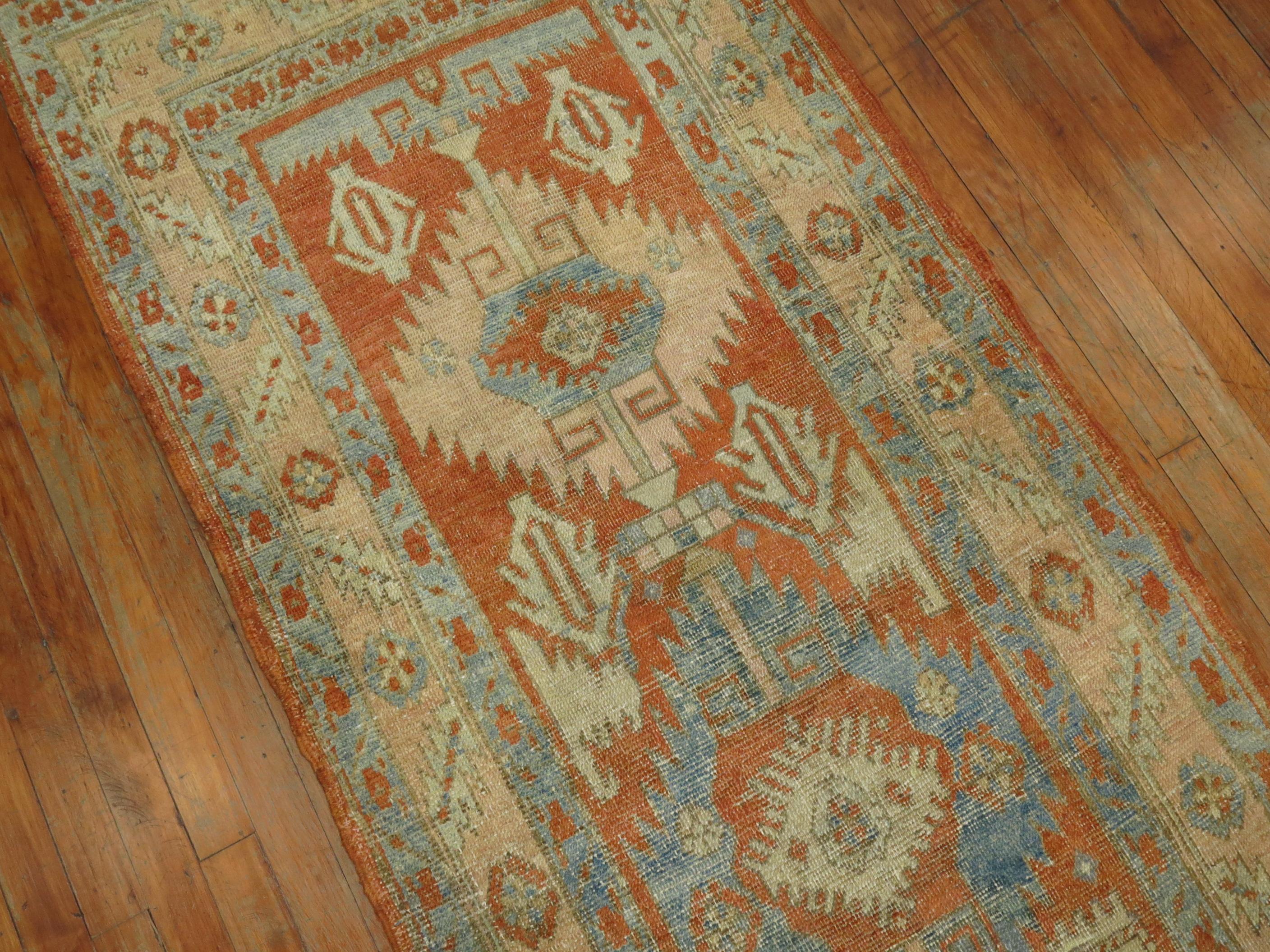 A long Persian Heriz geometric antique runner from the early 20th Century

Measures: 2'10'' x 15'5''.