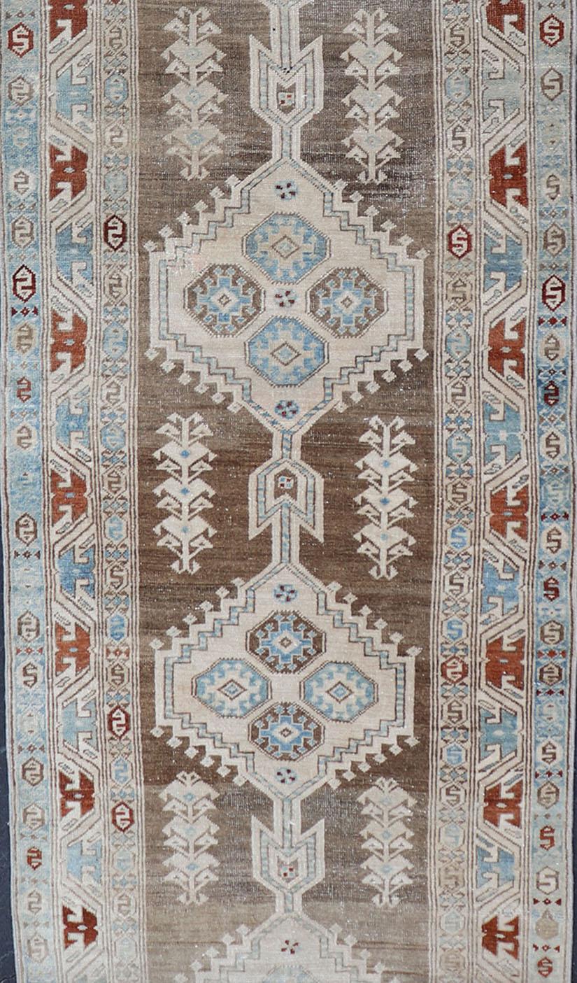 Antique Heriz Persian long runner with multi-medallion and geometric design from Persia, rug EMA-7568 , country of origin / type: Iran / Heriz, circa 1920

Measures: 3'4 x 17'4

This magnificent long Persian Heriz runner bears an exquisite