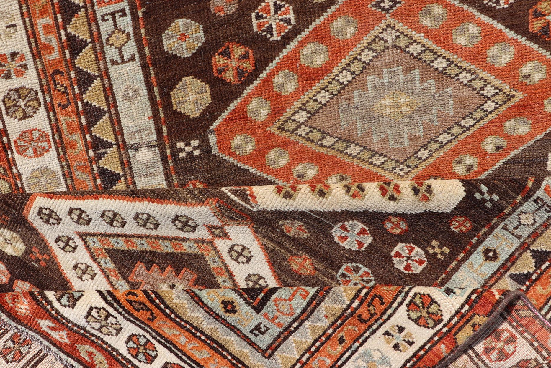 Long Persian Kurdish Runner with Medallion Design in Brown, Orange and Cream In Excellent Condition For Sale In Atlanta, GA