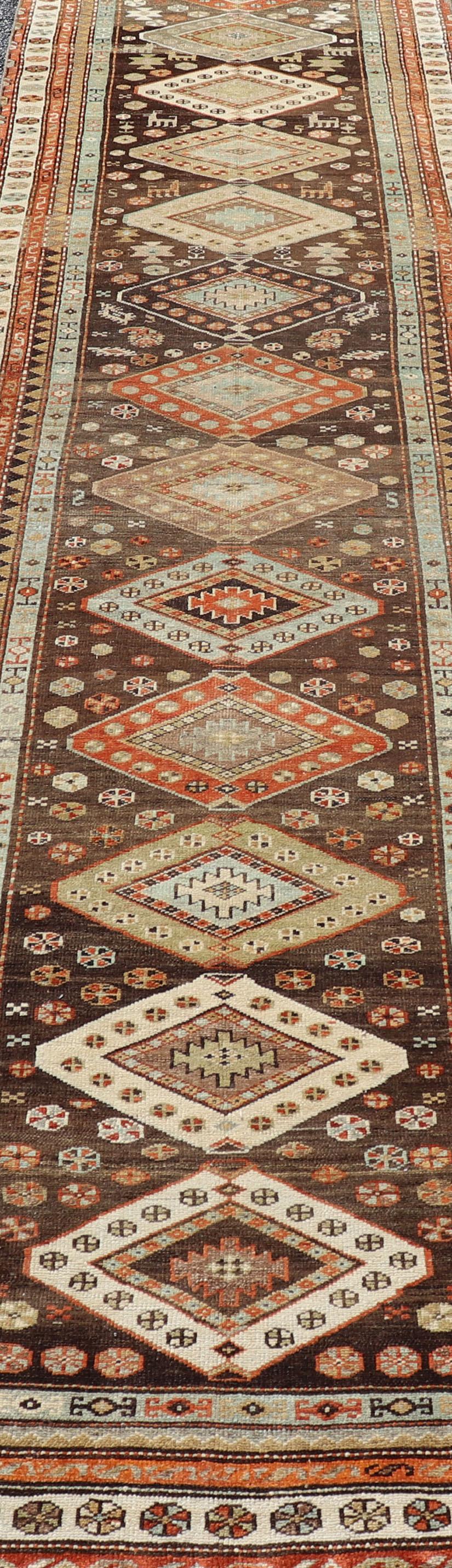 Wool Long Persian Kurdish Runner with Medallion Design in Brown, Orange and Cream For Sale