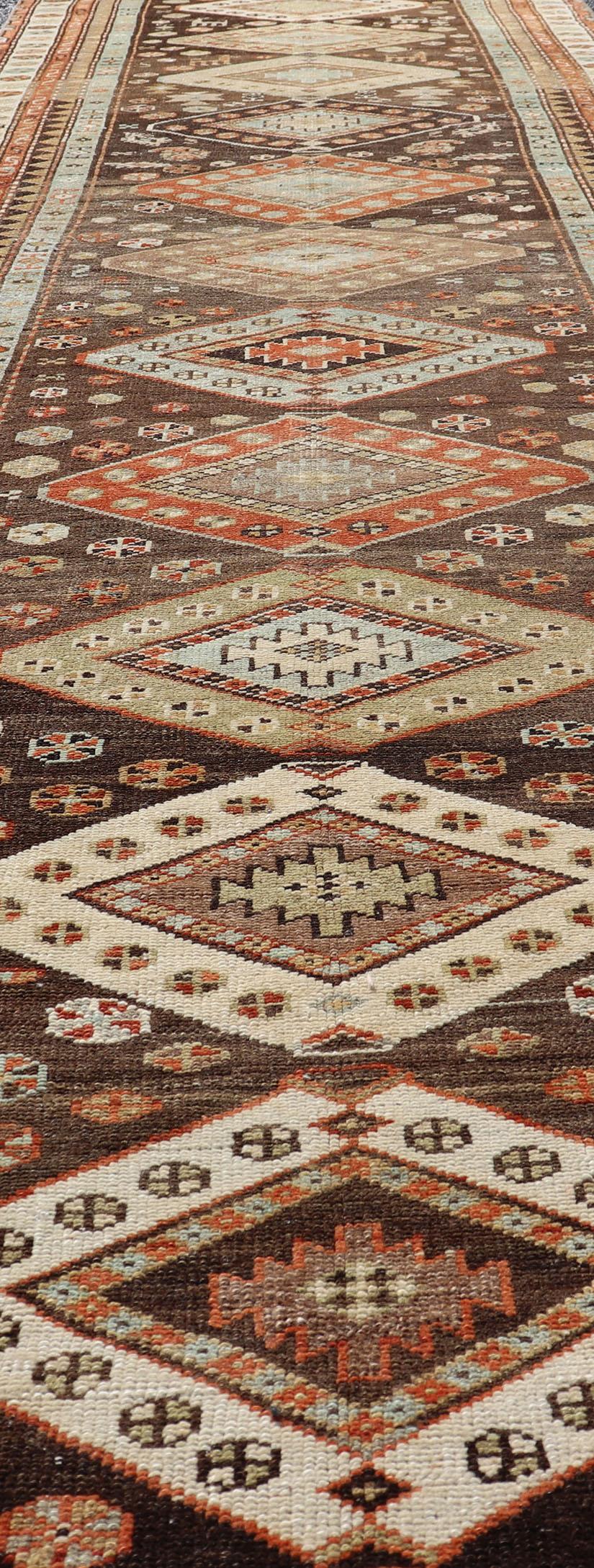 Long Persian Kurdish Runner with Medallion Design in Brown, Orange and Cream For Sale 1