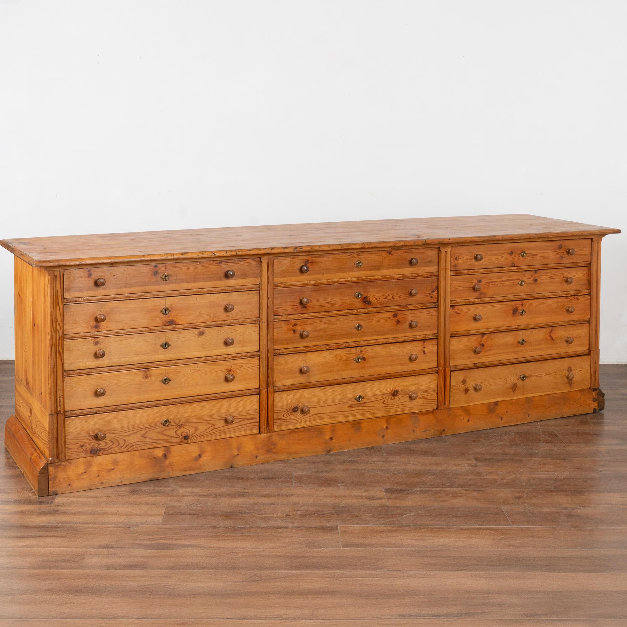 Pine apothecary shop counter with 15 drawers. Known as a 