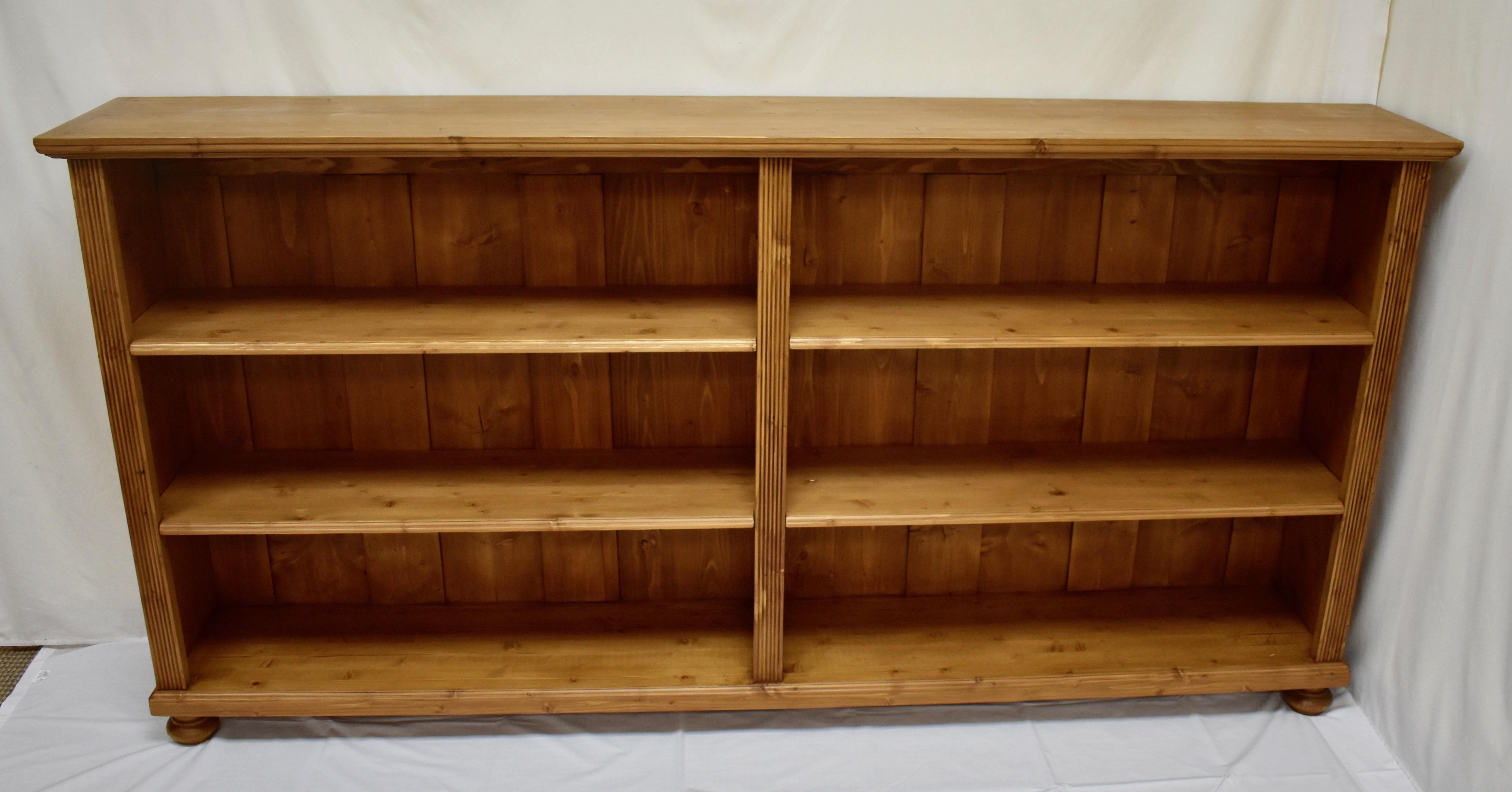 Antique pine bookcases can be hard to find and so can well-made reproductions. Using design features and methods of construction copied from our antique pine furniture, our workshop in Europe takes lightly-used reclaimed pine and fashions our
