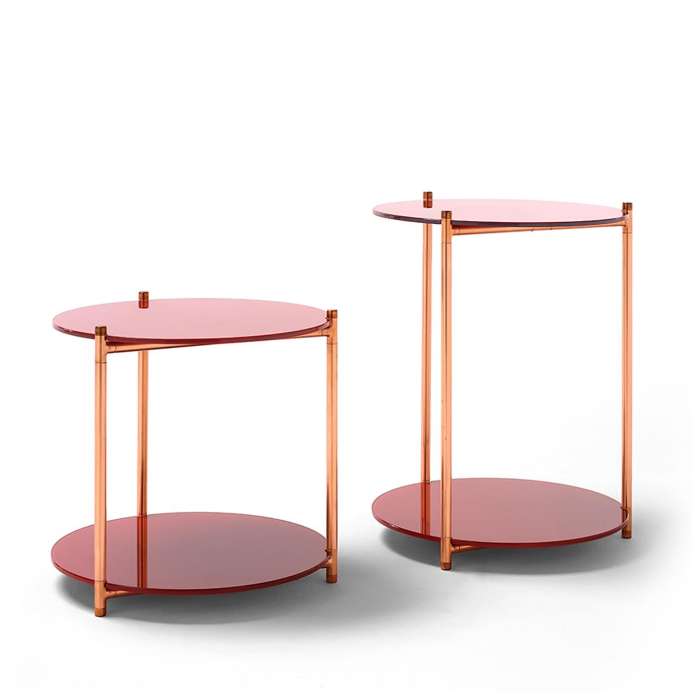 The luminosity of copper blends with the reflective quality of back-painted glass in this enchanting side table inspired by the Long Playing Étagère. The cylindrical frame is made of steel on the inside and copper along the outside and consists of