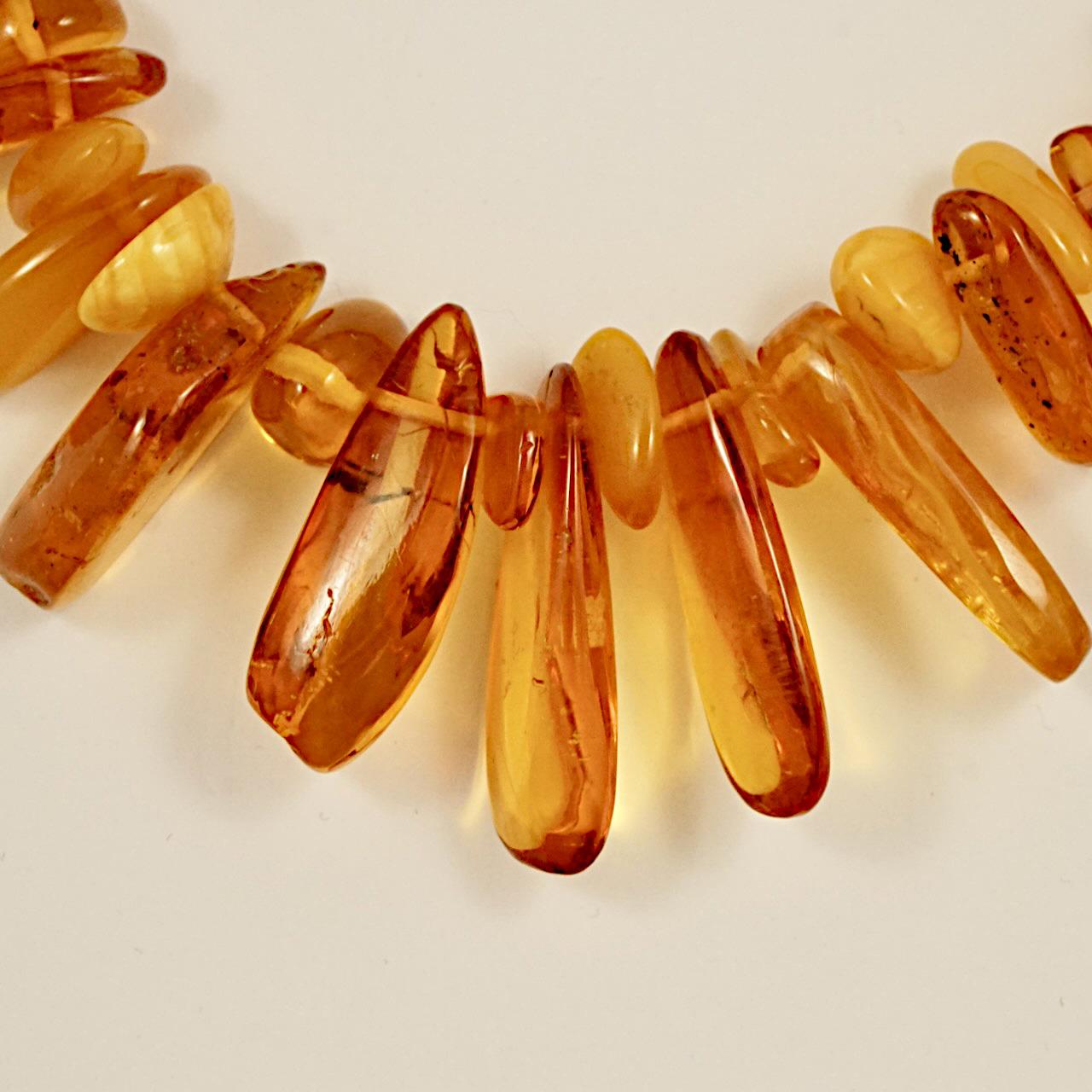 Wonderful long amber graduated bead drop necklace with beautiful polished amber beads. The necklace length is 65.5 cm / 25.78 inches, and the longest drop is 3.5 cm / 1.37 inches. It is in very good condition. 

This beautiful amber bead necklace is