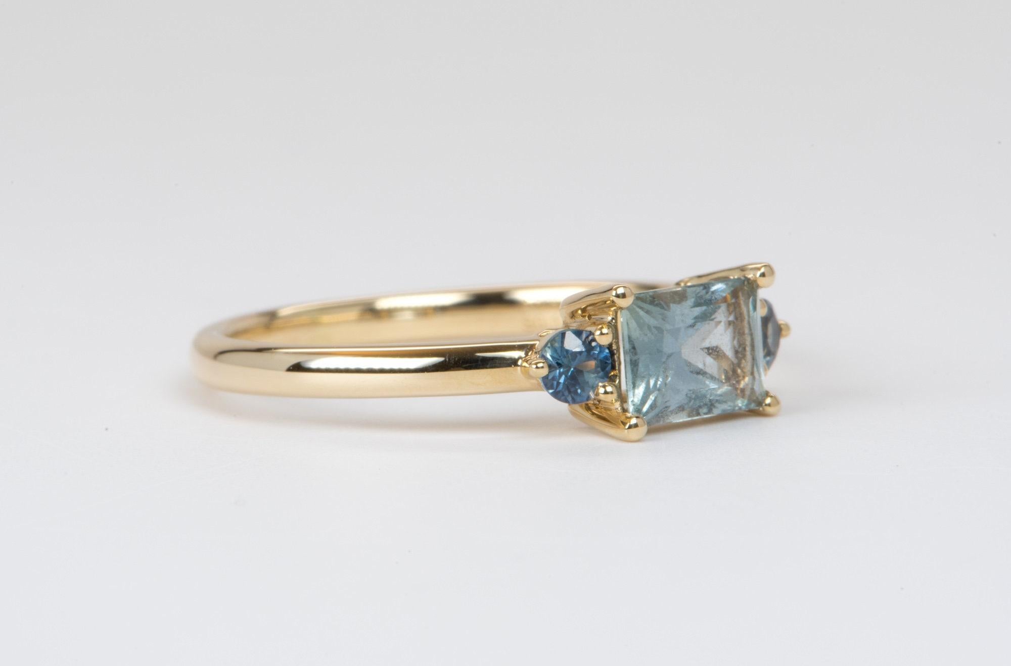♥  Solid 14K yellow gold ring set with a rectangle-shaped Montana sapphire, flanked with two sapphires on each side
♥  The overall setting measures 12.1mm in width, 5.3mm in length, and sits 4.0mm tall from the finger

♥  Ring size: US Size 6.5