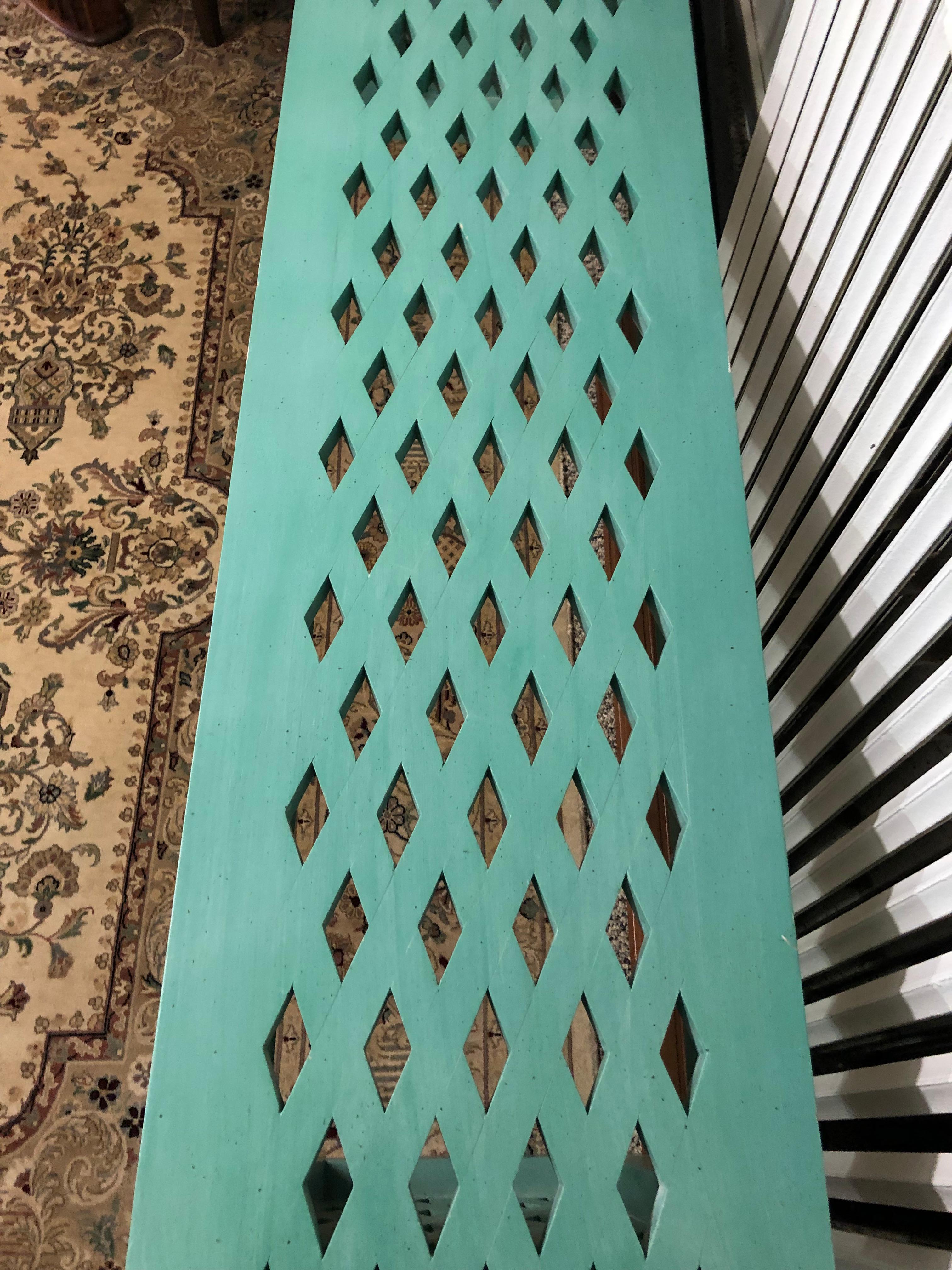 Fabulous vintage Mid-Century Modern Parsons style long console table having cut out diamond pattern on top and sides and painted a sensational turquoise aqua. Signed underside as shown in photo.
