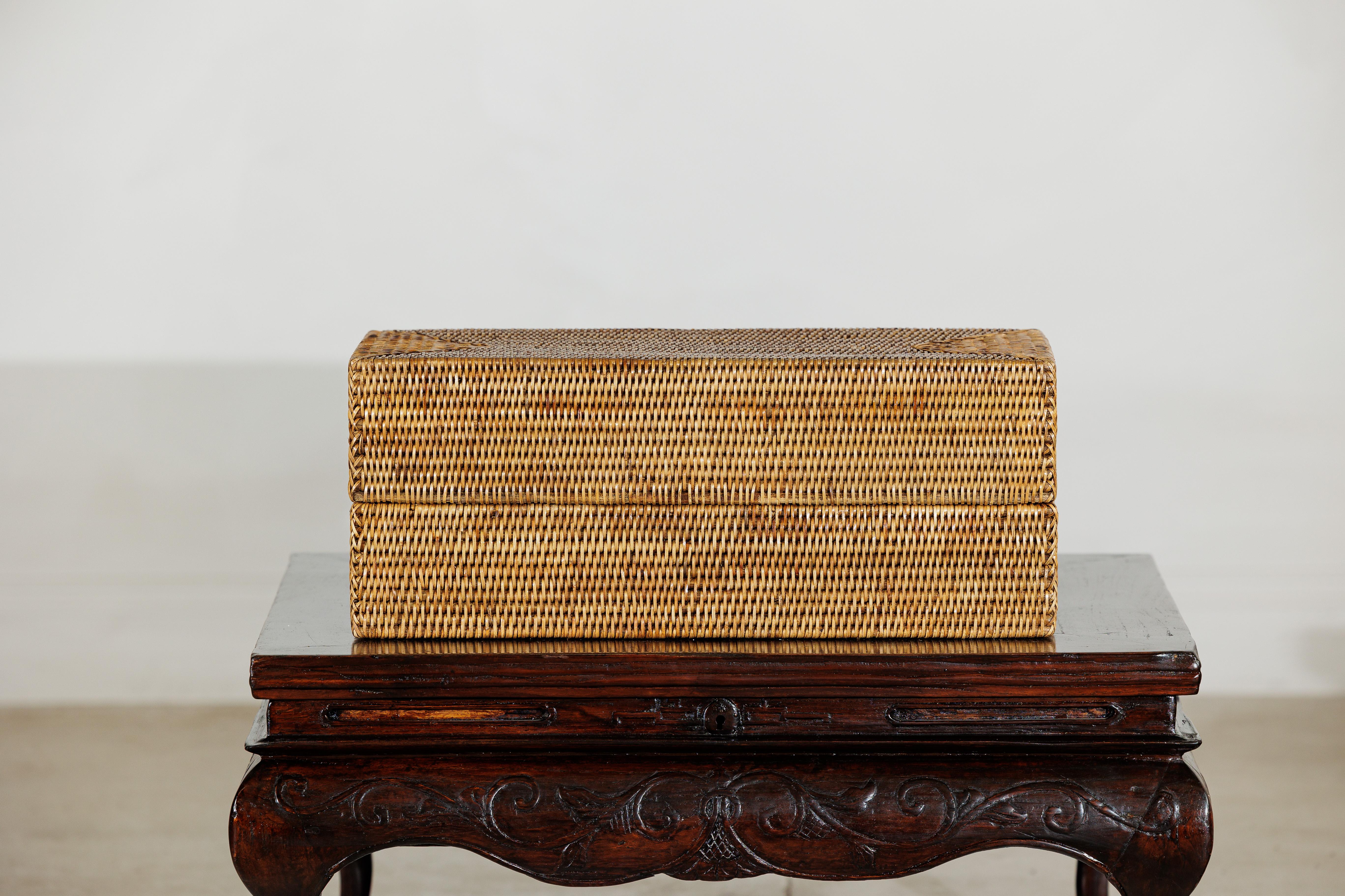 A woven poem in rattan, this long rectangular lidded box captures the quiet elegance of natural fiber and handwoven craftsmanship. Its elongated shape and neatly articulated corners highlight the precision of the weave, while the honey-gold tones of