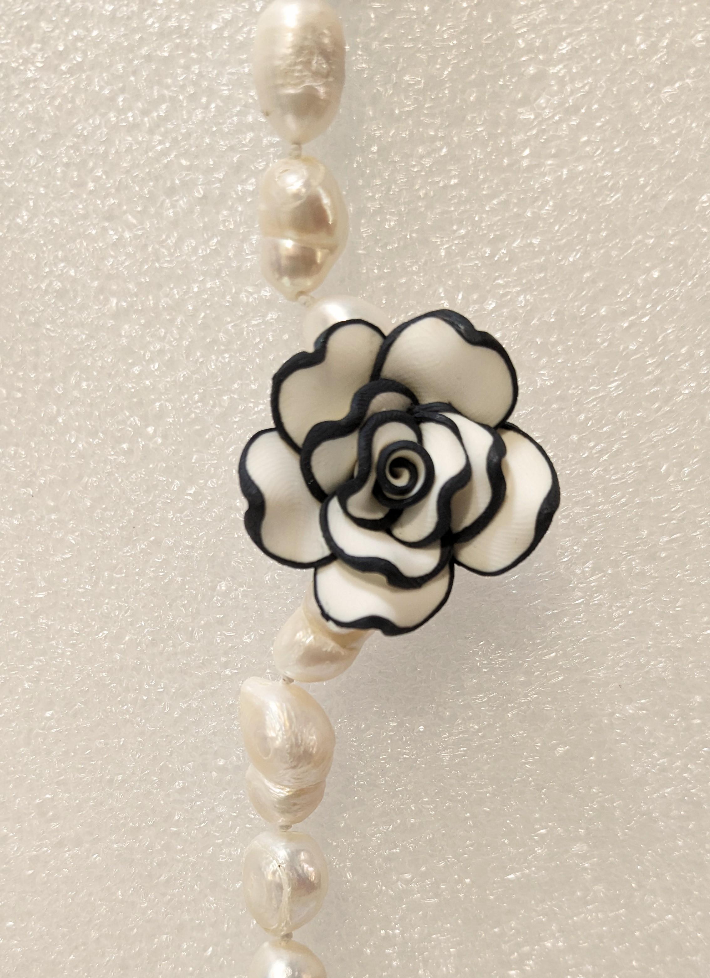 Contemporary  Long River Pearl Necklace with Chanel-type Resin Flowers. For Sale