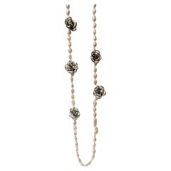 Vintage  Long River Pearl Necklace with Chanel-type Resin Flowers.