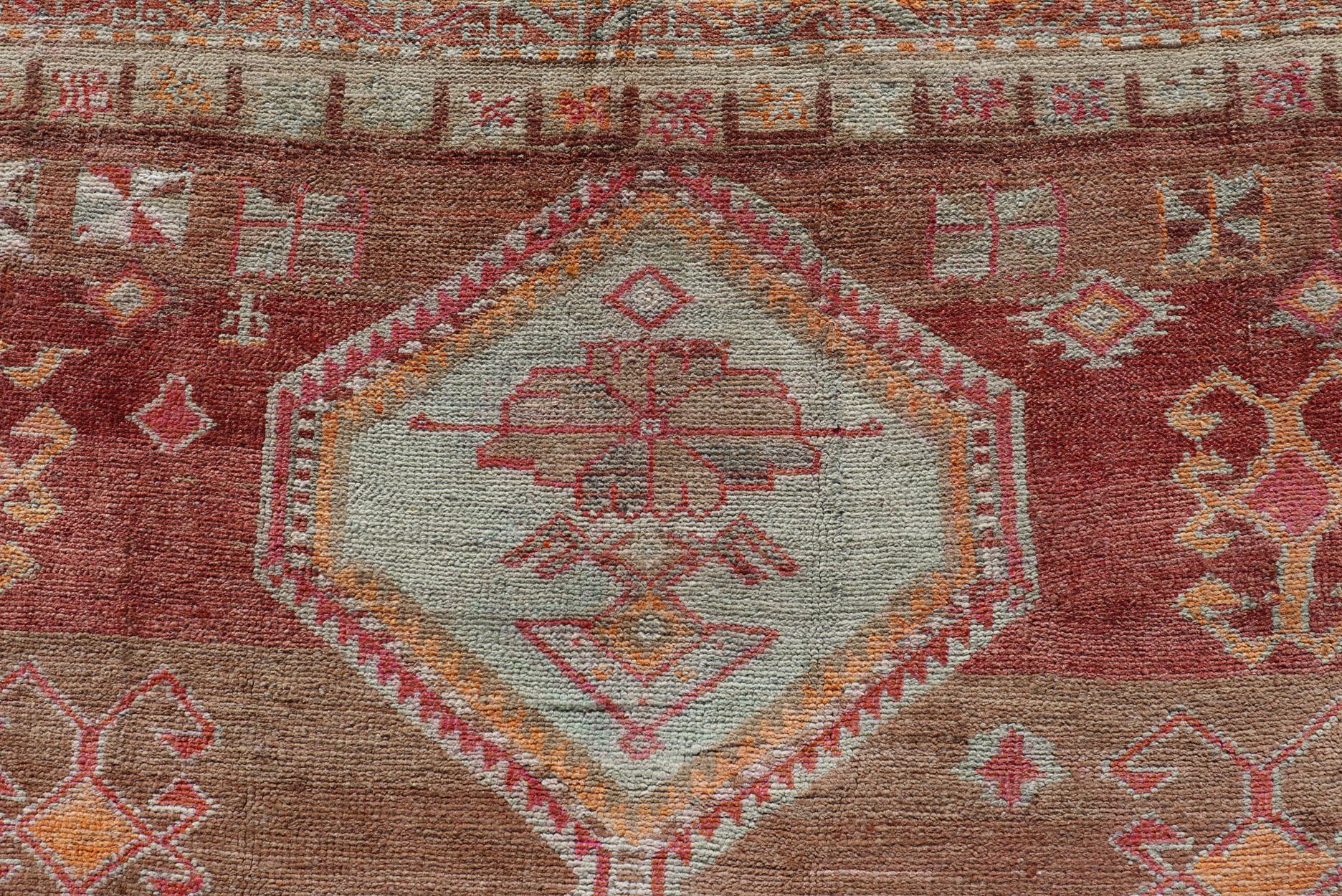 Long Rug, Vintage Turkish Gallery Rug with Tribal Design in Variegated Red In Excellent Condition For Sale In Atlanta, GA