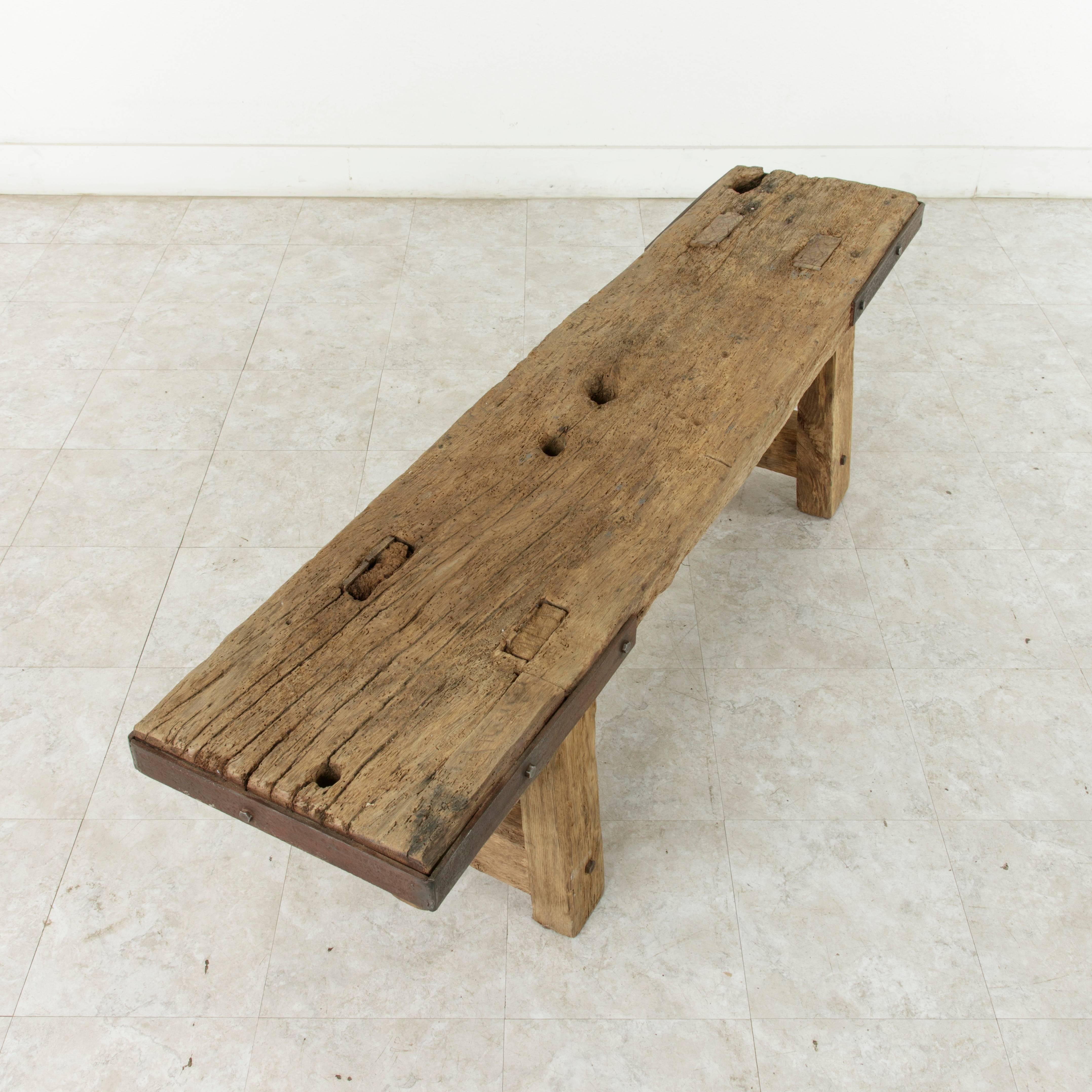 19th Century Long Rustic French Oak Bench in Natural Finish with Iron Corners and Crossbar