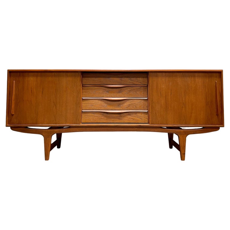 Long Sculpted MidCentury Modern Styled Danish Teak Credenza For Sale at 1stDibs