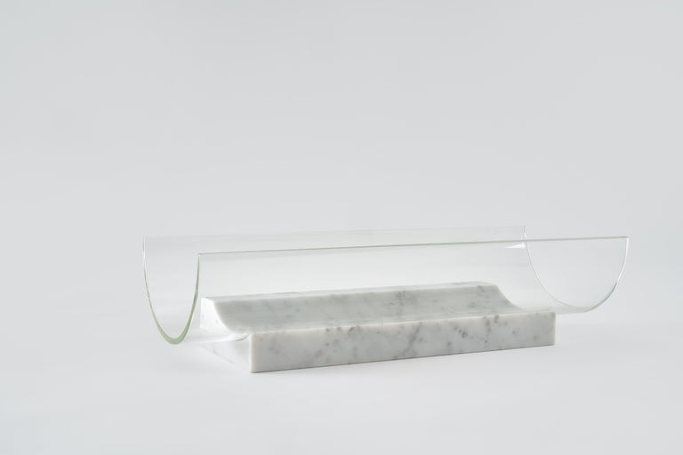 Long Segno bowl - Giorgio Bonaguro
Dimensions: D 38 x W 15 x H 11 cm
Materials: White Carrara marble, glass.

A collection that was born from the desire to recover marble processing waste: small portions of slabs with different thickness,