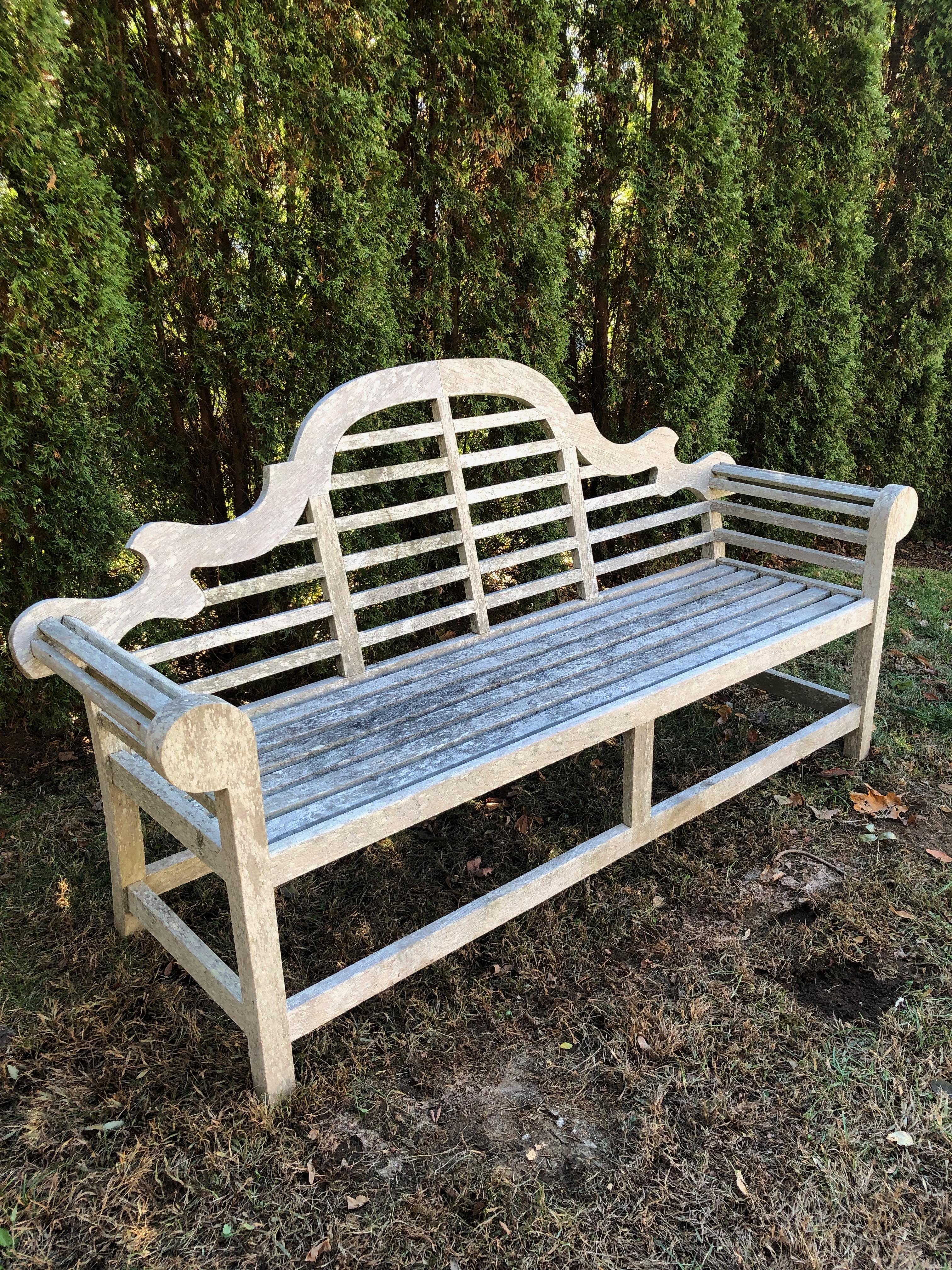 This classical teak bench, originally designed by the famous English architect Sir Edwin Lutyens in the early 1900s, has a lovely silvered surface with a hint of lichen that belies its age. Perfect against an evergreen hedge or as a viewing spot for