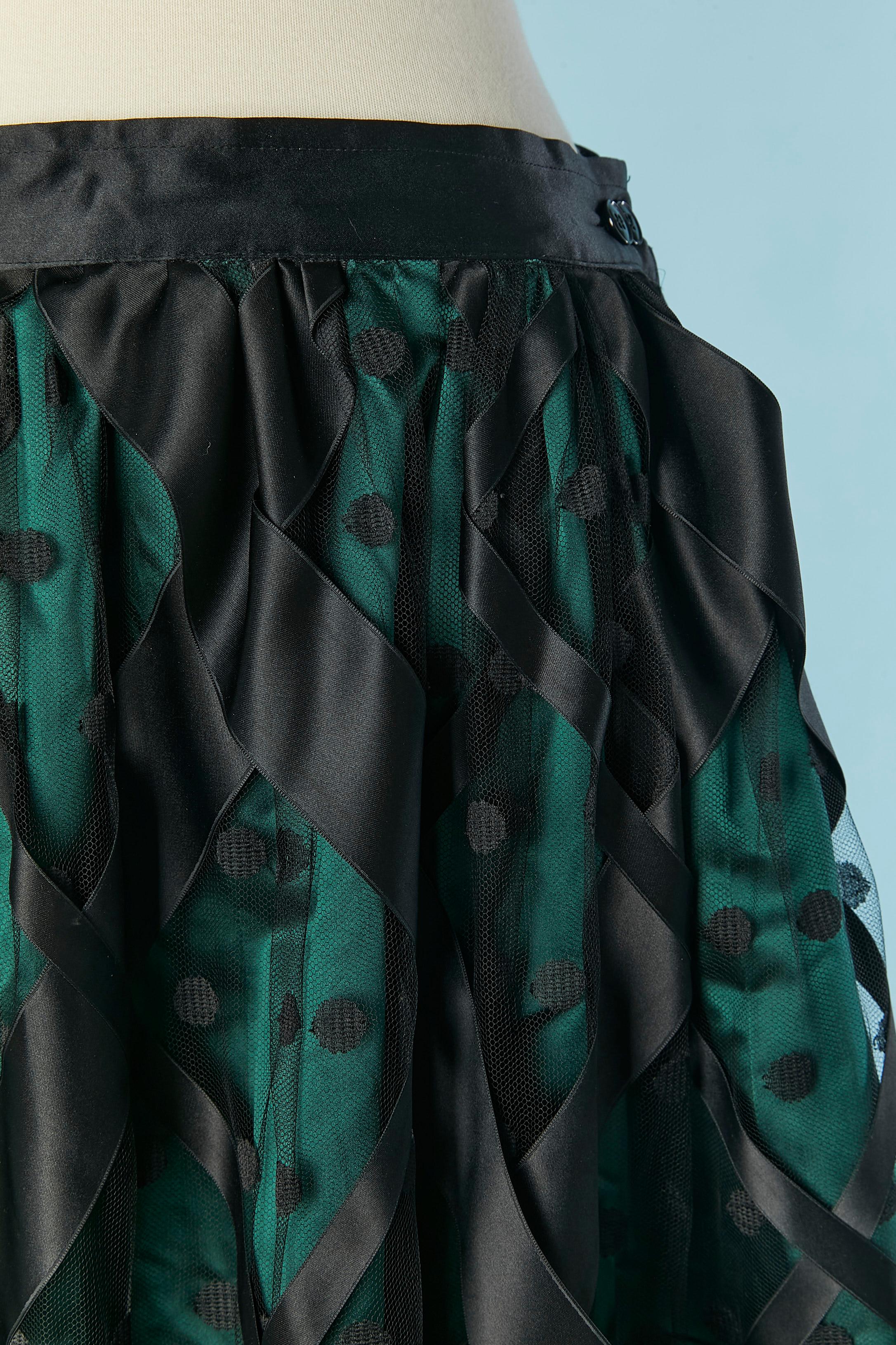 Long evening skirt in green satin, Polka-dot tulle and black ribbon appliqué. 
Button and buttonhole closure on the middle back ( adjustable, there is 2 buttons) 
SIZE 38 (Fr) M 