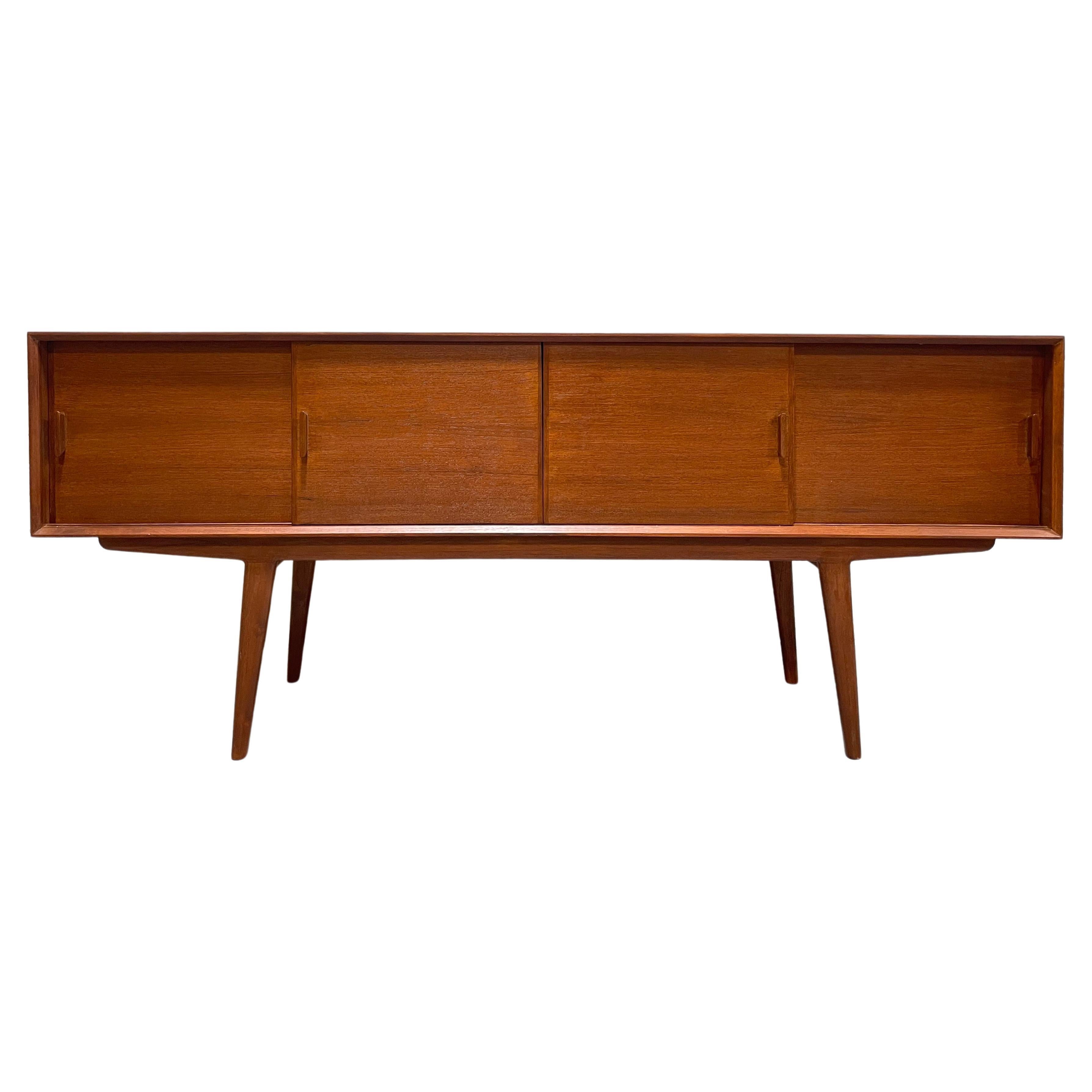 Handmade Long + Sleek Mid century styled Modern credenza / media stand with the most gorgeous wood grains. Perfect layout for a media stand or vinyl storage - generous shelving for components paired with extra long tapered Danish style legs. Each
