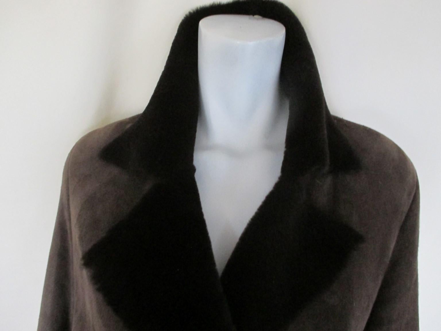 Super soft quality suede and lamb interior long coat.

We offer more lambskin and fur items, see our frontstore.

Details:
It has 2 pockets, 1 inside button and 3 closing hooks.
Sleeves can be roll up and down
Light-weight
Color is brown
From the