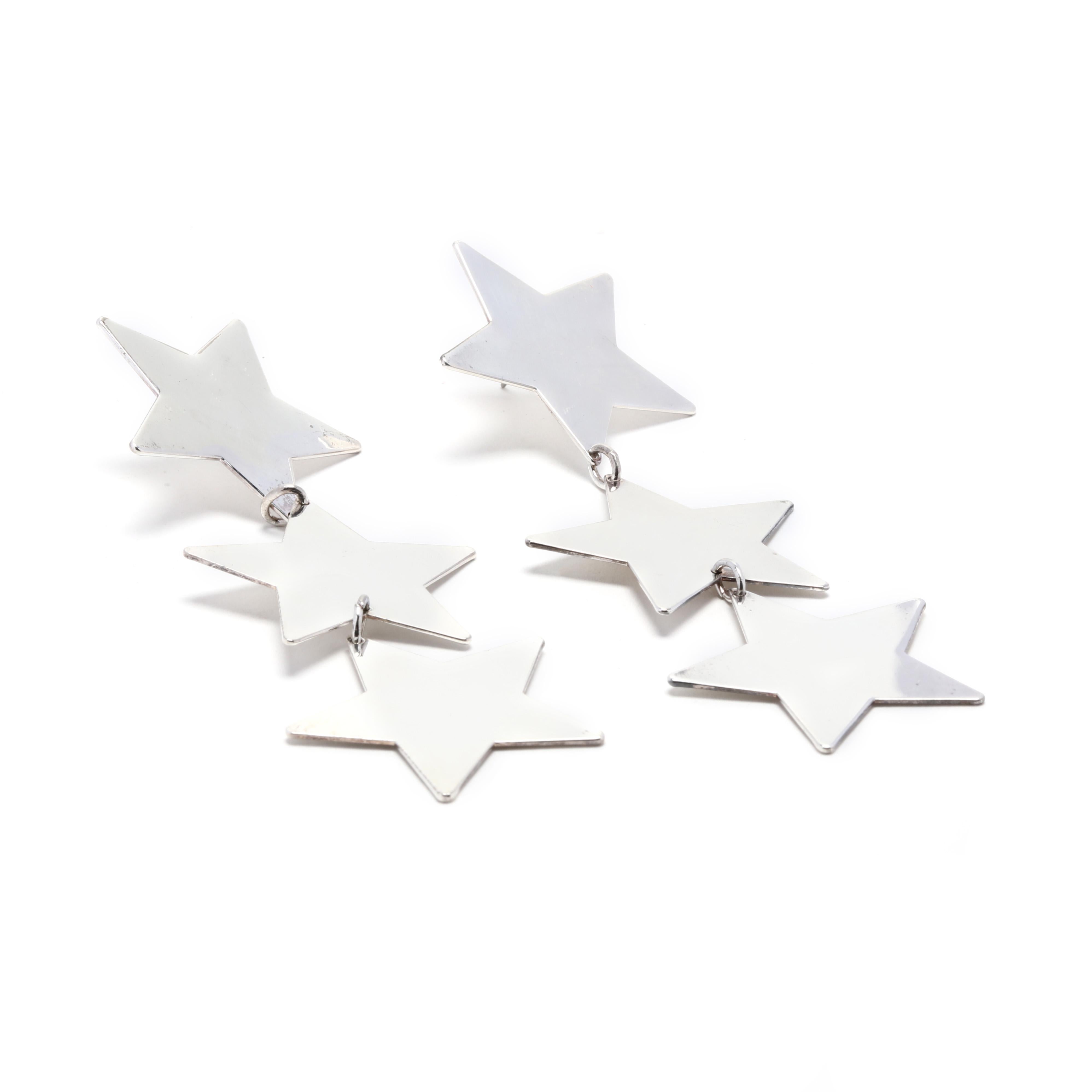 These stunning long star earrings in sterling silver will take your look to the next level! Crafted from tarnish-resistant sterling silver, these star earrings measure 3.75 inches in length and feature a dangling star shape that will certainly turn
