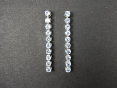 Longues boucles d'oreilles en argent sterling avec topaze bleue