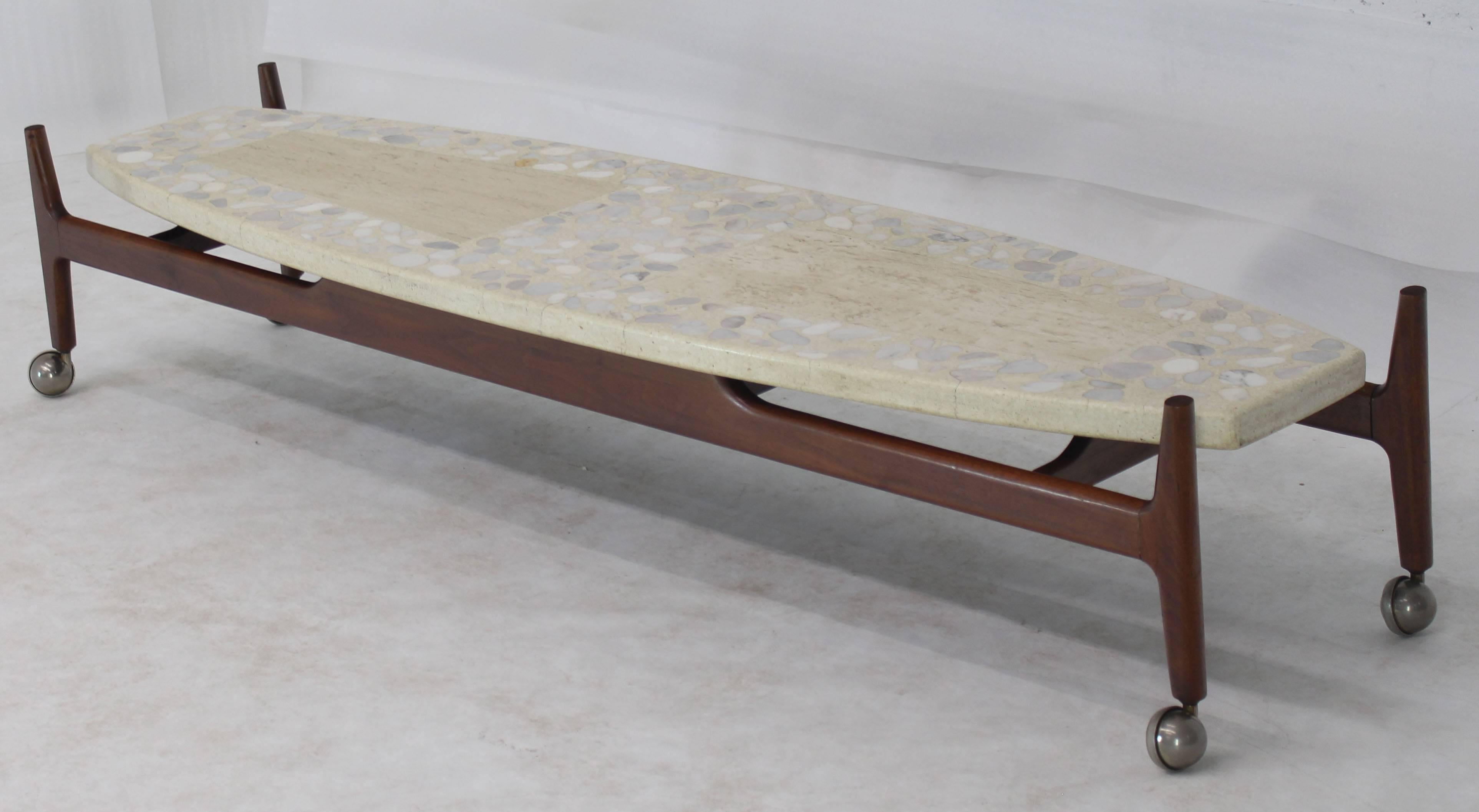 Floating terrazzo top oiled walnut base long surfboard shape coffee table Kagan decor.