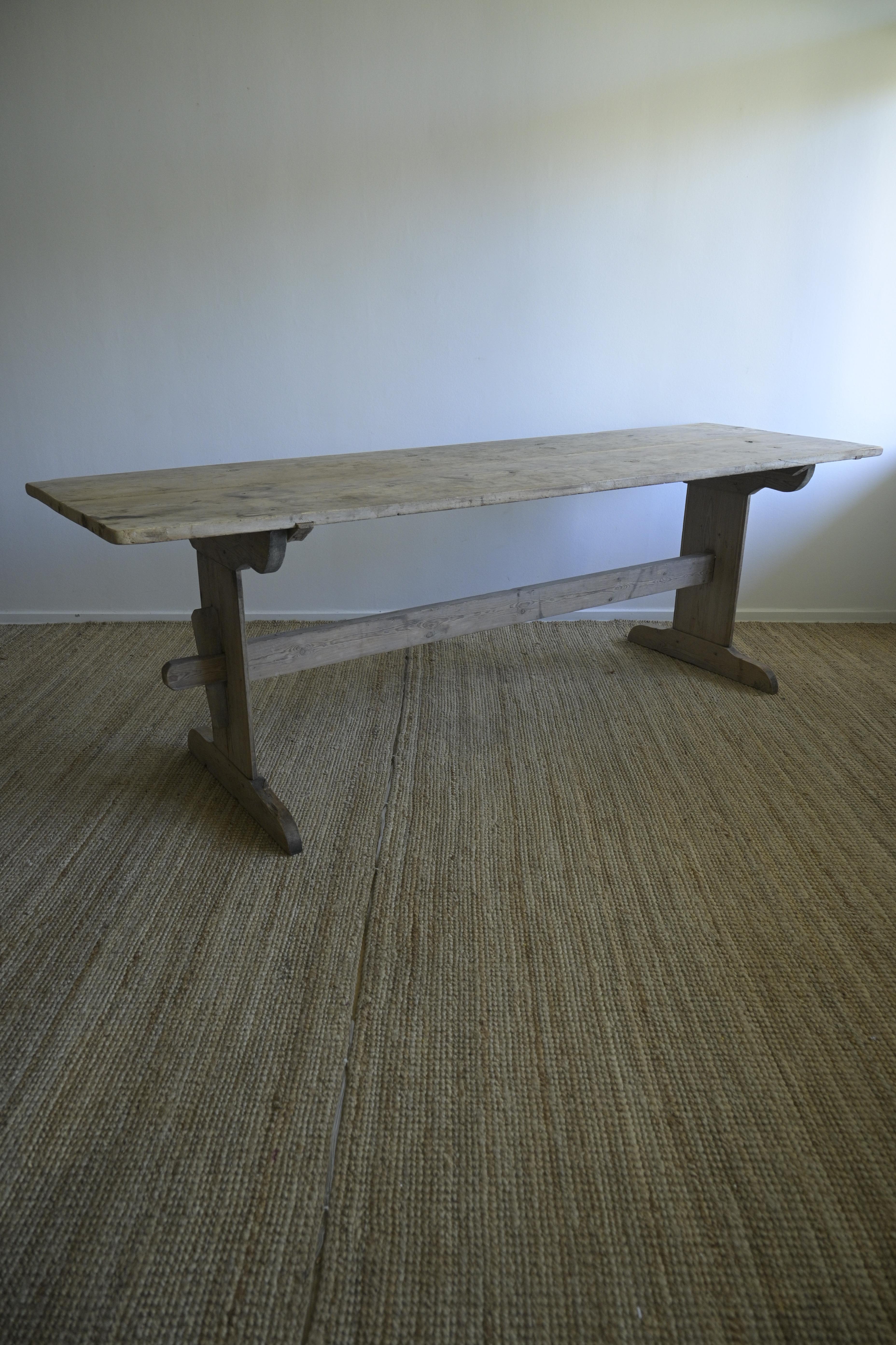 Long Swedish Trestle Table ca 1780

This table comes from Alfta in Hälsingland, Sweden, and has a great length with a beautifull smooth, heavy patina.
The colors range from gray, brown to black, with nicks, scuffs, and a depth from constant wear