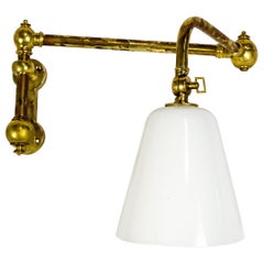 Long Swing Arm Brass Sconce with Glass Shade by Ann Morris