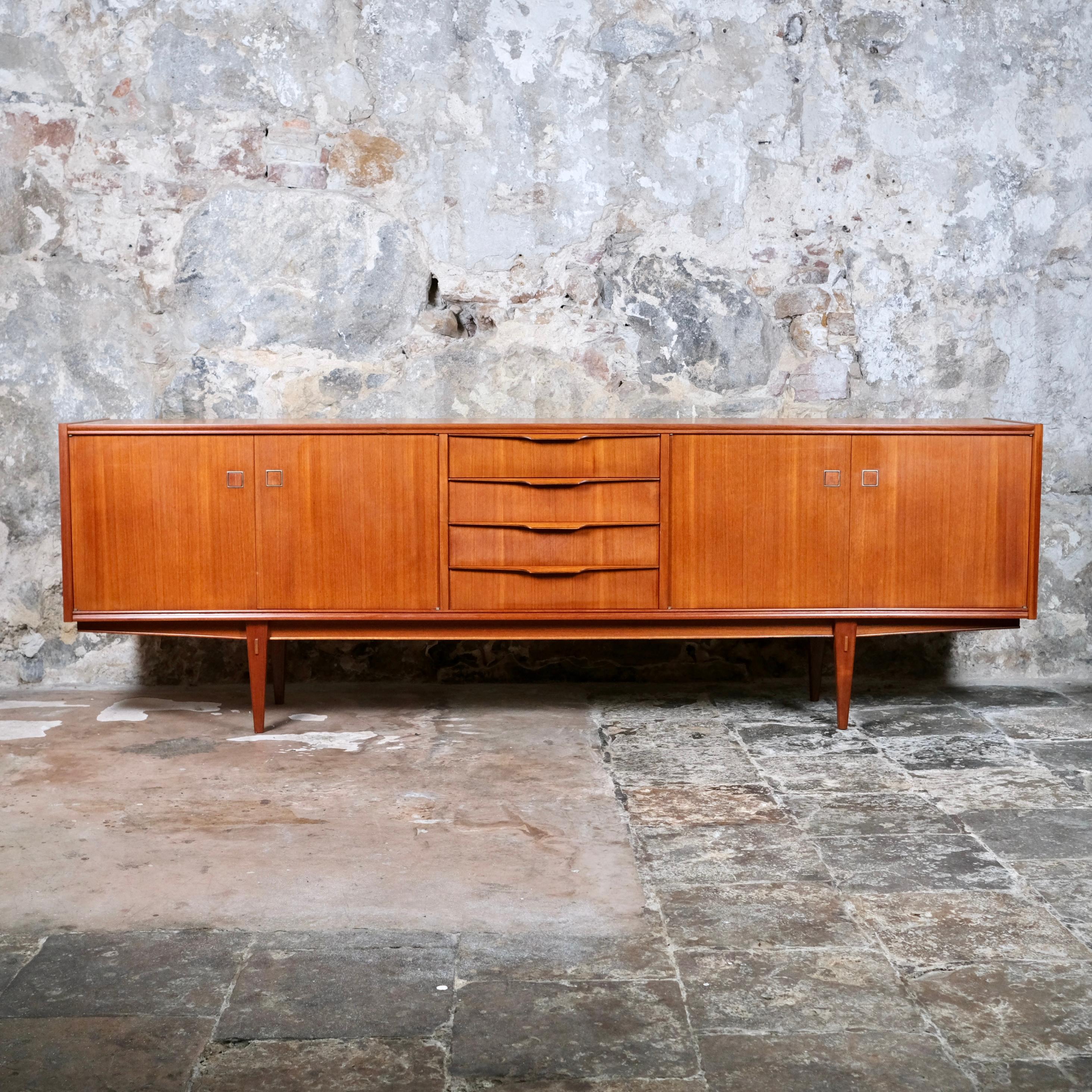 Beautiful teak sideboard from the 1960s, made in France by Arnaud edition.
Scandinavian style, with nice making and joining details.
Very good condition, a light faded stain on the 2nd drawer, light traces of time (discrete scratches).
NF sticker (=