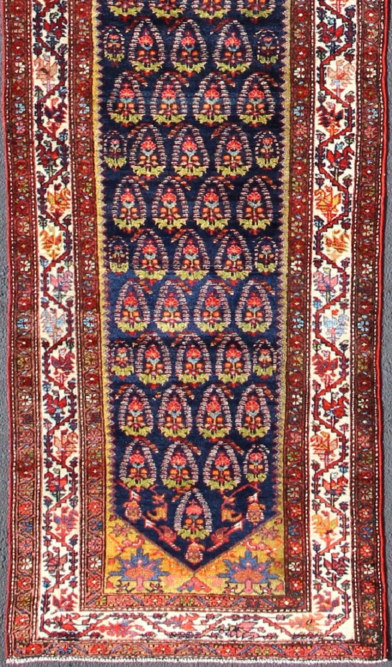 Multicolored antique Persian Malayer runner with sub-geometric tribal design, rug ema-7572, country of origin / type: Iran / Malayer, circa 1900.

This magnificent antique Persian Malayer runner (circa 1900) bears a beautiful, expansive, all-over