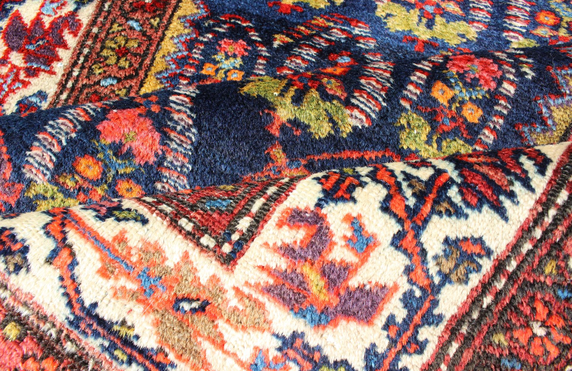 Early 20th Century Long Tribal Antique Persian Malayer Runner in Blue, Red, Green, Ivory For Sale