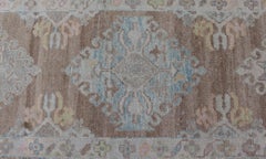 Long Turkish Oushak Runner with Pale Blue, Soft Yellow, and Light Brown Motifs