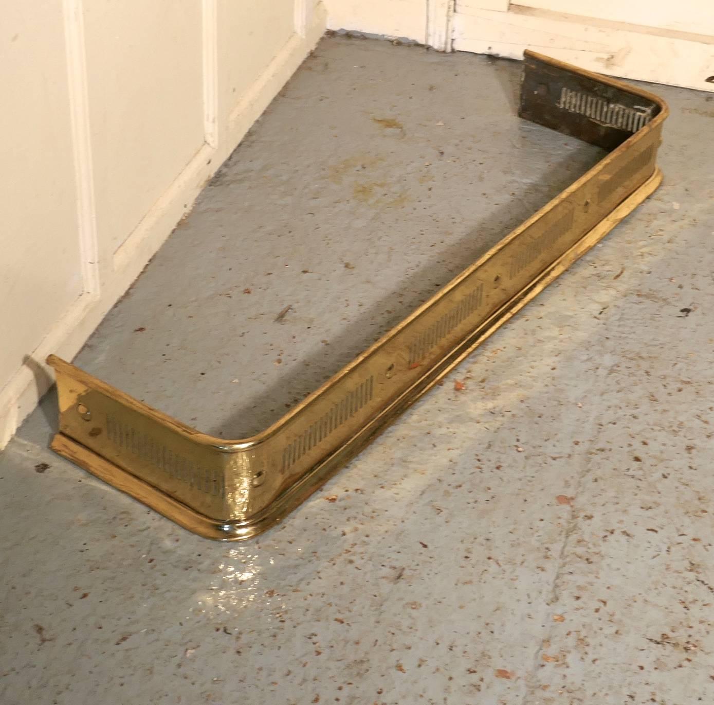 Long Victorian pierced brass fender 

This is a very superior quality Victorian pierced brass fender it has delicate piercing along the front and sides with a flat base for stability
 
The fender is in very good condition, it is 6” high, and 43”