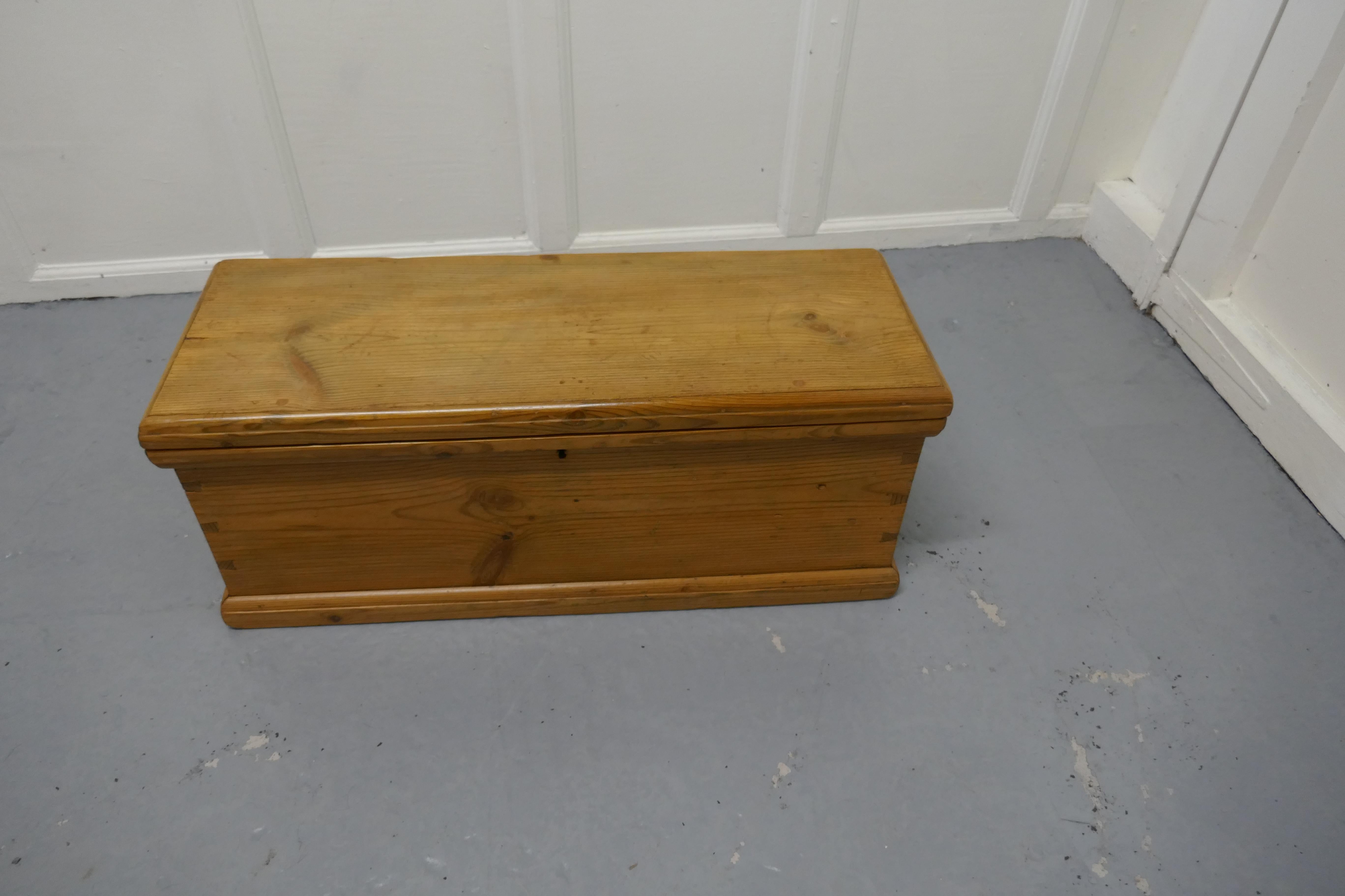 Long Victorian pine carpenters box or sea chest coffee table

This is a good quality pine box it has been fully restored, it stands on a small plinth it is long and narrow with handles at each end
So a blanket box, a toy chest, shoe box for the